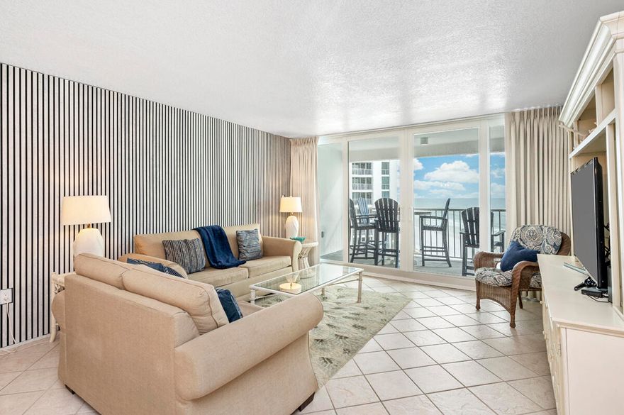 DIRECT GULF FRONT (FULLY RENOVATED) UNIT on the 8th floor! Incredible views! GATED gulf front community with 24 hr onsite security and lots of amenities. Shoreline Towers complex has just undergone a $20 million dollar renovation that includes all new hurricane impact doors and windows, balcony renovations and more.     The unit is turn key rental ready and has a fantastic layout with a large gulf facing master suite with king size bed and floor to ceiling windows and the guest bedroom has two queen beds and windows facing the beach.  Unit has a large kitchen with all electric appliances, breakfast bar, and its own laundry center.  .You can gain access to the open balcony from both the living room and primary bedroom.