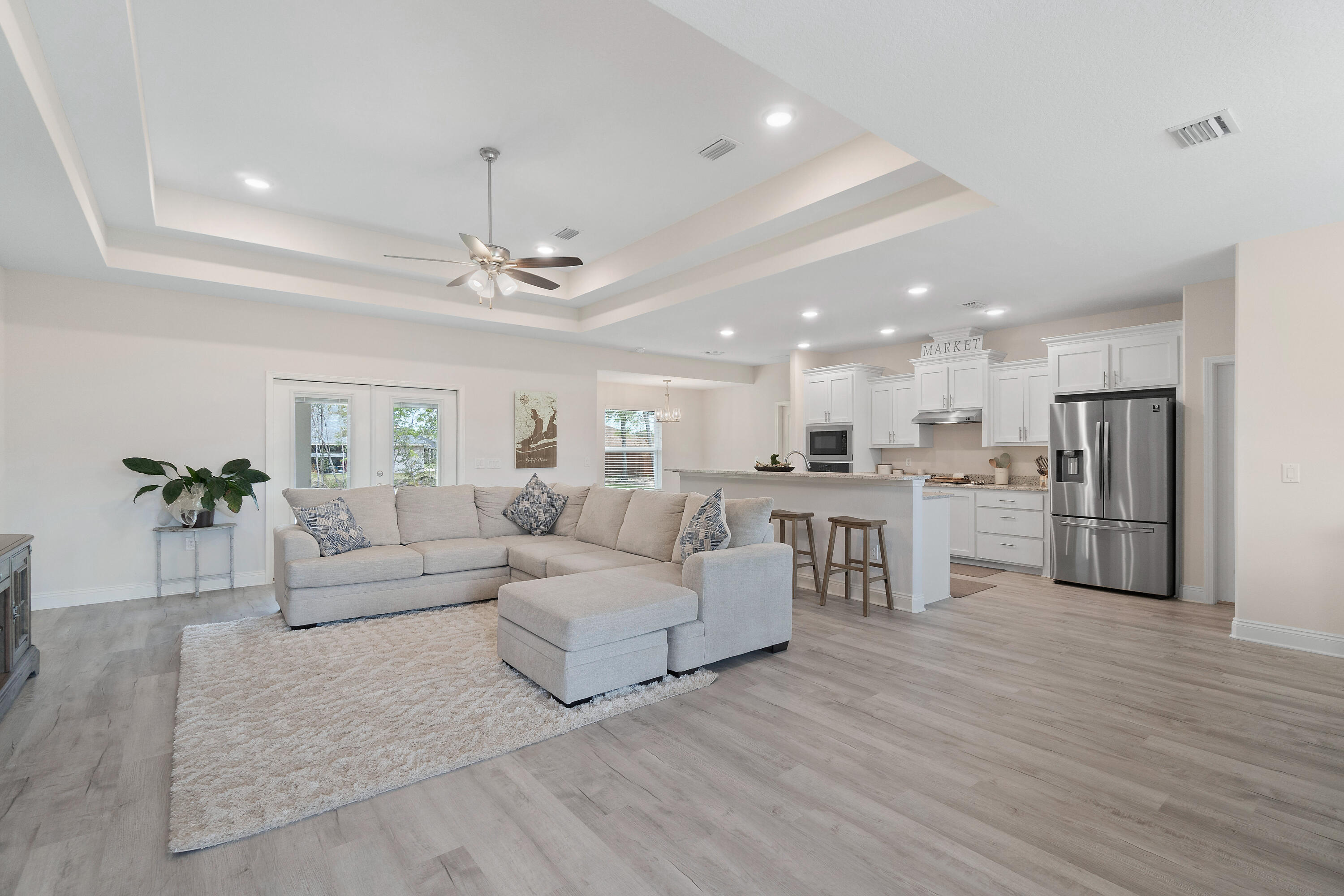 CURRENTLY UNDER CONTRACT: SELLER ACCEPTING BACK UP OFFERS. This beautiful home awaits you in the newly developed Plantation Woods! When you step into this home you walk into the open floor plan of the living and dining area that has tray ceilings and beautiful vinyl flooring. To the right is the kitchen which comes equipped with upgraded granite countertops, cabinets, over oven microwave, glass stove top with hood vent and a beautiful triple door refrigerator. Offset to the left of the kitchen is a breakfast nook area which leads you into the oversized master bedroom that also has tray ceilings. The master bath comes with dual vanities and granite countertops, an upgraded tile shower w/ glass door and large walk in closet. Offset to the right of the kitchen is your laundry room.
