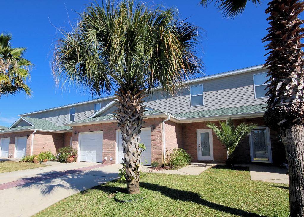 Nicely updated two bedroom town home at Magnolia Park is move-in ready! This unit features tile floors in the living areas and new carpet in the bedrooms. The kitchen with a convenient breakfast bar is open to the good sized family room. Both bedrooms are suites with a private bath and a walk-in closet. Magnolia Park Town Homes offers a community pool and is located in the heart of Destin within a mile of the gorgeous Destin Harbor. This is one of the best deals right now in Destin, don't miss it!!