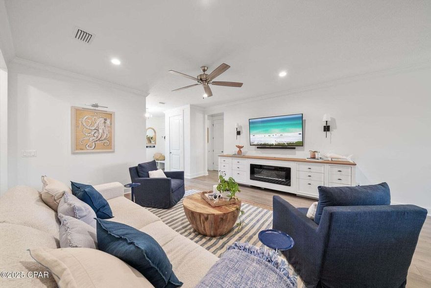 CENTRAL PANAMA CITY OASIS -- NO HOA, GOLF CART TO PUBLIX & STARBUCKS! Why settle for HOA rules when you can enjoy all the perks without the restrictions? This almost-new construction home is perfectly located just outside of SweetBay in a NO HOA neighborhood--yes, really! Hop on your golf cart for a quick ride to the brand-new Starbucks or grab groceries at Publix, all just minutes away in SweetBay's lively town center--without ever having to deal with HOA guidelines. Inside, you'll find thoughtful upgrades throughout. The custom-built master closet offers maximum organization. The designer laundry room and entryway mudroom add both function and flair. Elegant crown molding enhances the living, dining, and kitchen areas, while board & batten accent walls bring charm to both the primary and guest bedrooms. The living room showcases a custom-built entertainment center, and the upgraded glass shower door adds a spa-like touch to the bathroom. Out back, the fully fenced private yard is ideal for pets, playtime, or quiet evenings with friends. Low-maintenance, full of custom details, and in an unbeatable locationthis is city living with freedom. Don't miss your chance to own this gemschedule your showing today!