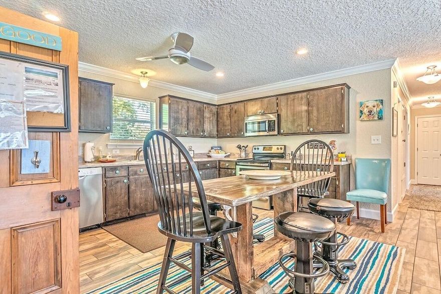 Stunning Fully Remodeled 4-Bedroom, 2-Bath Home on 1 Acre - Move-In Ready!Welcome to this beautifully renovated 4-bedroom, 2-bathroom home, nestled on a generous 1-acre lot. Boasting modern finishes and an open, airy layout, this property is perfect for those seeking both comfort and style. Featuring tile flooring throughout, this home is both durable and easy to maintain, offering a sleek and polished aesthetic.Key Features:Fully Furnished: The home is being sold completely furnished, making it a turnkey option for those ready to move in.Spacious Living Areas: Enjoy the open-concept living, dining, and kitchen spaces.Split Floor Plan: Enjoy the privacy of the master bedroom situated on the opposite end of the home from the other 3 bedrooms.