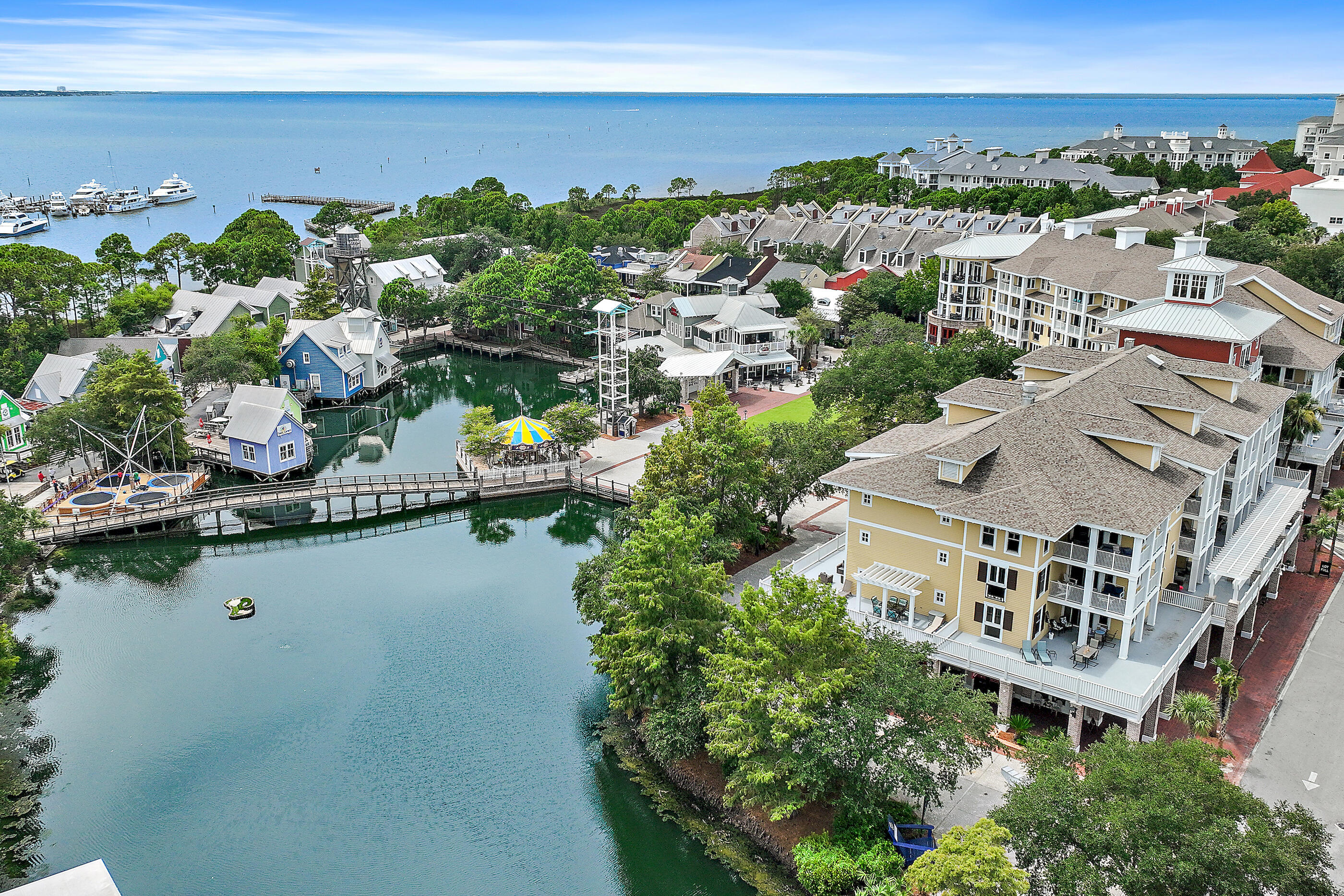 Lifestyle and amenities to fit the whole family! Recently updated and fully furnished, this 2 bedroom, 2 bathroom corner unit in the heart of Baytown Wharf is the perfect getaway! Located in Observation Point South, this spacious condo features updated flooring throughout and a wraparound balcony - ideal for taking in the weekly fireworks, lounging or entertaining. Enjoy a lagoon style pool, grilling area, fitness room, and walking paths. The Founders Club has a large screen TV, seating area, kitchen, pool table, and roomy balcony overlooking the Events Plaza. Bring your beach gear, this unit also comes with a storage cage in the garage!