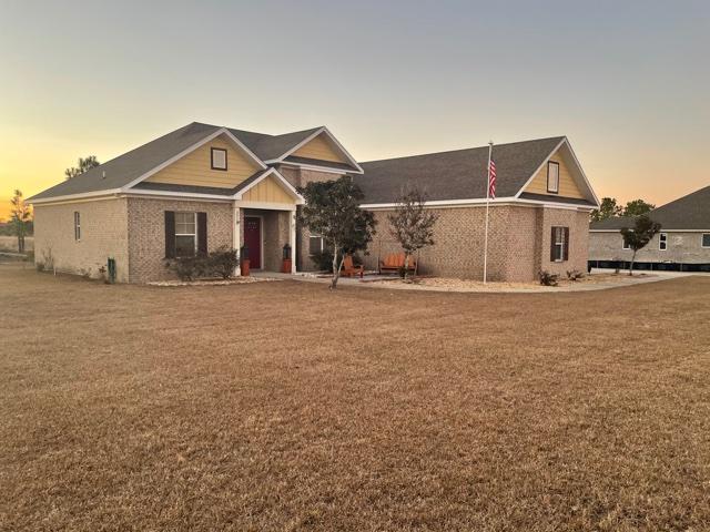 Custom built home on 14th Fairway of the Windswept Estates Golf Court. Community features tennis courts, basketball, volley ball, hiking trails, playground and community pool. 3 bedrooms in the main house with a large bonus room with closet above the garage that can be used as a 4th bedroom. Home built with 2x6 framing and spray foam insulation and 14 SEER a/c for energy efficiency. Interior features include 10' and 16' ceilings, barrel ceiling in foyer, coffered ceiling at living room, solid core 8' interior doors, stained cabinets with granite counter tops and upgraded stainless appliances and 18' tile floors. Home on 1/2 acre lot backing up to 14th fairway.