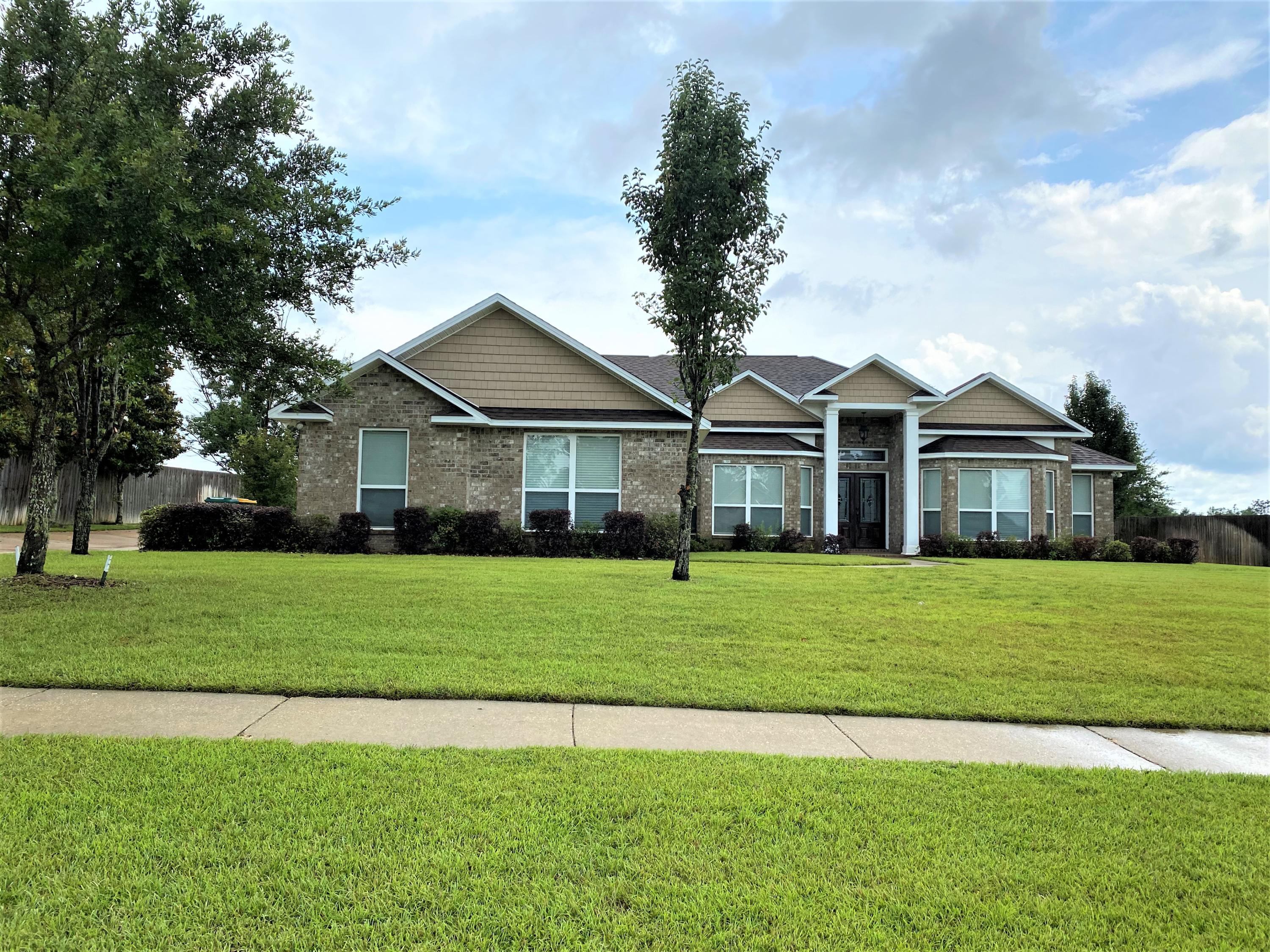 One of a kind.  This custom built home located in the desirable Carnegie Hills Subdivision, is a real eye catcher.  From the moment you drive up to the front yard this property will feel like you are home.  The beautiful custom stained front door opens into this semi open floor plan.  The large kitchen boast a breakfast bar with granite counter tops.  Lots of large cabinets and an oversize pantry.  Formal dinning with large crown molding.  Master bath is beyond imagination.  Large tiled shower,  custom double vanity with makeup vanity in the middle.  Lots of storage in this double sided walk in closet.  The upstairs comes with custom wired surround sound.  Large enough for a pool table or game room.  Back yard  can be enjoyed under the 16'x20' covered patio.  Call today this wont last lon