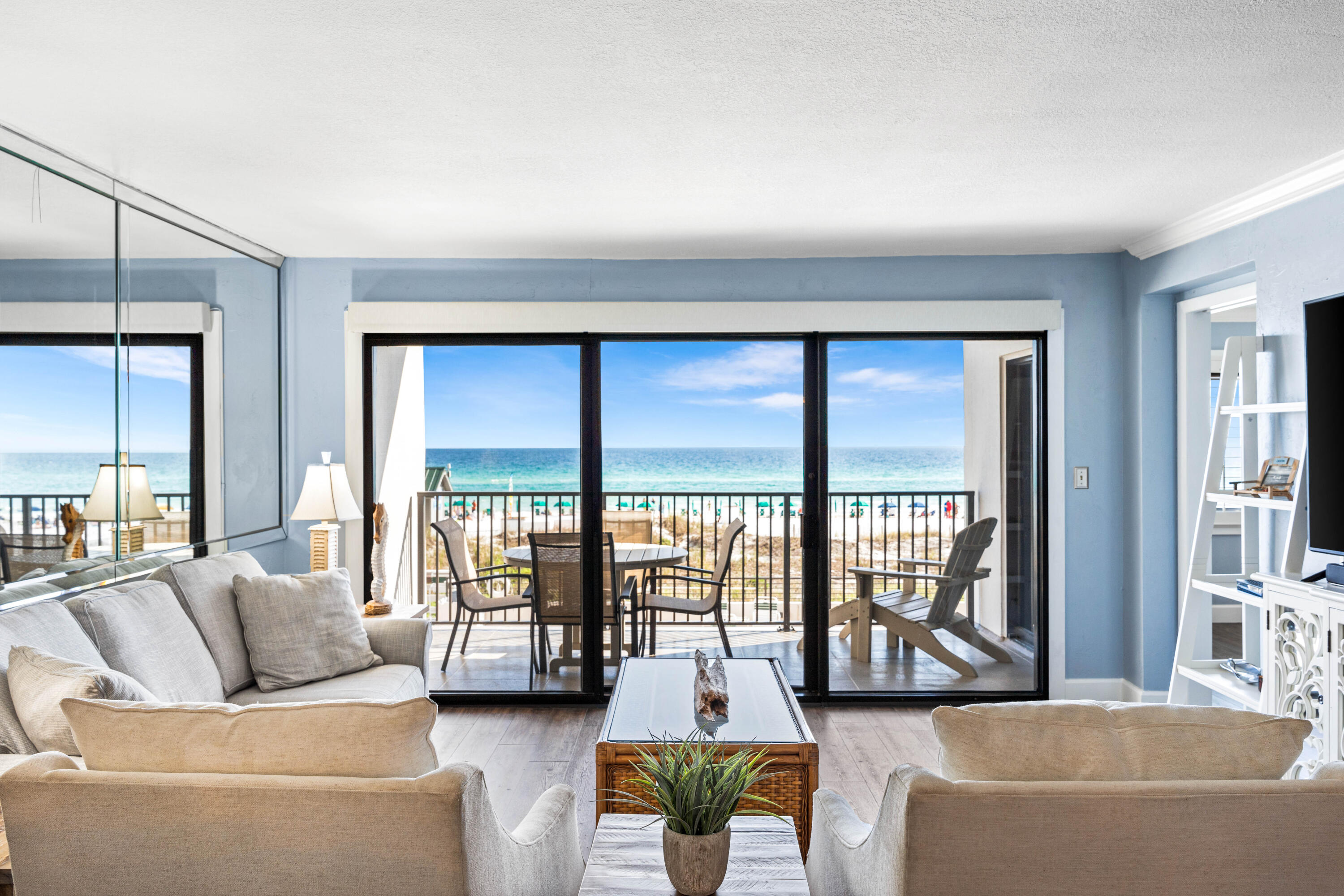 Luxurious Gulf-front unit available in the private, gated condominium of Emerald Towers, highly coveted for its breathtaking panoramic views of the azure Gulf waters and pristine white sandy beach from its second-floor vantage point. This stunning unit has undergone a complete renovation, boasting a modern kitchen equipped with sleek stainless steel appliances, quartz countertops, a stylish tile backsplash, custom illuminated cabinetry, a convenient wine cooler, pantry, and a bar with an ice maker. Laundry needs are met with ease thanks to the stacked LG washer and dryer tucked away in a closet. A stunning view of the turquoise waters of the gulf provides a backdrop for the kitchen, dining room and the living areas. Remote-controlled power window shades adorn the living area, adding convenience, ease, and sophistication to the space. The primary bedroom exudes comfort with its plush king-sized bed, plantation shutters, and direct access to the balcony, offering a tranquil retreat. The primary bath even has a built-in linen closet providing ample storage space, alongside a walk-in shower. The spacious second bedroom and the adjacent bathroom provides a retreat for guests after a fun day at the beach. This condo is truly a turnkey oasis. Residents of Emerald Towers enjoy access to an array of amenities, including a seasonally heated pool, tennis and pickleball courts, and a well-equipped exercise room featuring a sauna and steam shower for relaxation and rejuvenation. This unit is sold fully furnished, ensuring immediate enjoyment of the Emerald Towers lifestyle. Additionally, the entire exterior of Emerald Towers underwent a comprehensive restoration in 2022, further enhancing its appeal and longevity.