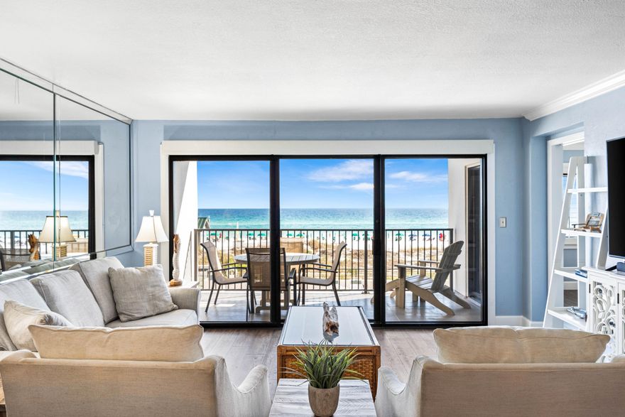 Luxurious Gulf-front unit available in the private, gated condominium of Emerald Towers, highly coveted for its breathtaking panoramic views of the azure Gulf waters and pristine white sandy beach from its second-floor vantage point. This stunning unit has undergone a complete renovation, boasting a modern kitchen equipped with sleek stainless steel appliances, quartz countertops, a stylish tile backsplash, custom illuminated cabinetry, a convenient wine cooler, pantry, and a bar with an ice maker. Laundry needs are met with ease thanks to the stacked LG washer and dryer tucked away in a closet. A stunning view of the turquoise waters of the gulf provides a backdrop for the kitchen, dining room and the living areas. Remote-controlled power window shades adorn the living area, adding convenience, ease, and sophistication to the space. The primary bedroom exudes comfort with its plush king-sized bed, plantation shutters, and direct access to the balcony, offering a tranquil retreat. The primary bath even has a built-in linen closet providing ample storage space, alongside a walk-in shower. The spacious second bedroom and the adjacent bathroom provides a retreat for guests after a fun day at the beach. This condo is truly a turnkey oasis. Residents of Emerald Towers enjoy access to an array of amenities, including a seasonally heated pool, tennis and pickleball courts, and a well-equipped exercise room featuring a sauna and steam shower for relaxation and rejuvenation. This unit is sold fully furnished, ensuring immediate enjoyment of the Emerald Towers lifestyle. Additionally, the entire exterior of Emerald Towers underwent a comprehensive restoration in 2022, further enhancing its appeal and longevity.


