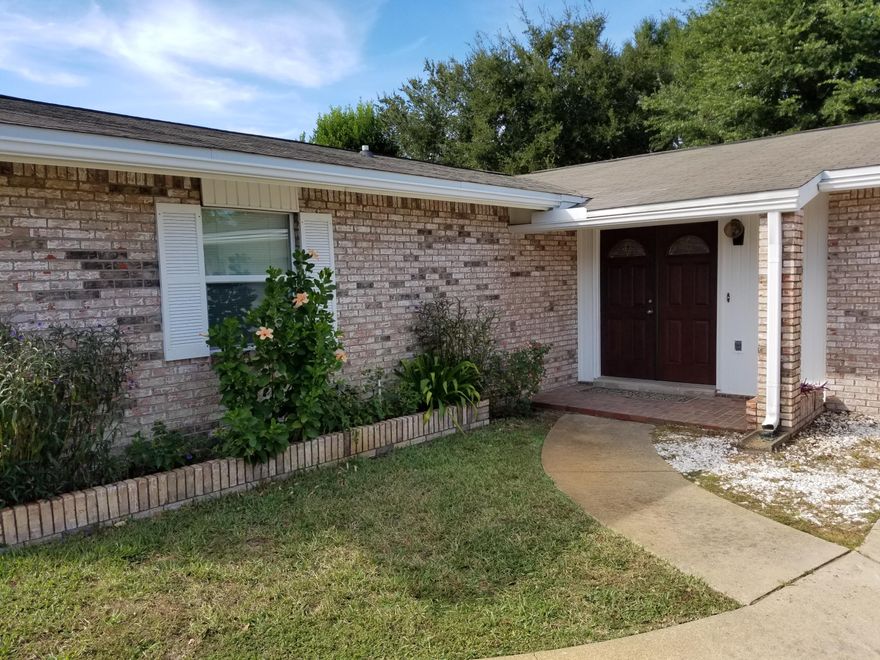 This home has been remodeled and improved. Entering into the foyer through the double doors you notice the beautiful travertine stone floors. From the foyer you can enter a private bedroom with sliding doors opening to a private courtyard. This room would make a nice home office also. The living room, dining room and kitchen all flow together. Travertine floors make this area feel more spacious. New kitchen cabinets and granite counter tops. A pantry for storage. The kitchen has a custom arch opening. The guest bathroom has been remodeled including travertine floors. The master suite is wonderful. A custom circular tray ceiling, crown molding and wood floors give a nice feeling. Two walk-in closets with features such as electrical outlets. The master bath has a whirlpool tub, separate
