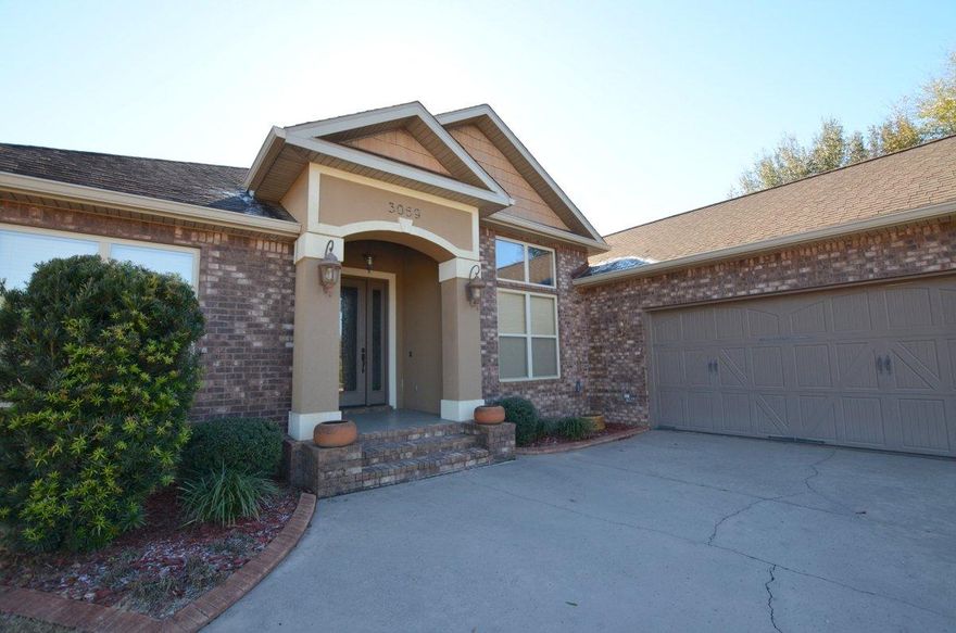 Elegant. Charm. Gorgeous. Just a few words to describe truly custom home! Just a few minutes drive from the heart of Crestview this 2454 square foot home is a head turner. Built in 2008, the beautiful home has so many additional touches - it is simply a must see to appreciate both the craftsmanship and heart that was put in to this homes unique construction. You will find tiled floors throughout this lovely home as well as custom window casings, oversized 8 foot doors, and crown molding that seems to be around every corner you look . Master bedroom has trayed/coffered ceilings with lighting and there is an additional private room just off the master. Room can be used as a private office or even workout room! Master bathroom is massive with glassed shower, whirlpool tub, walkin closet and