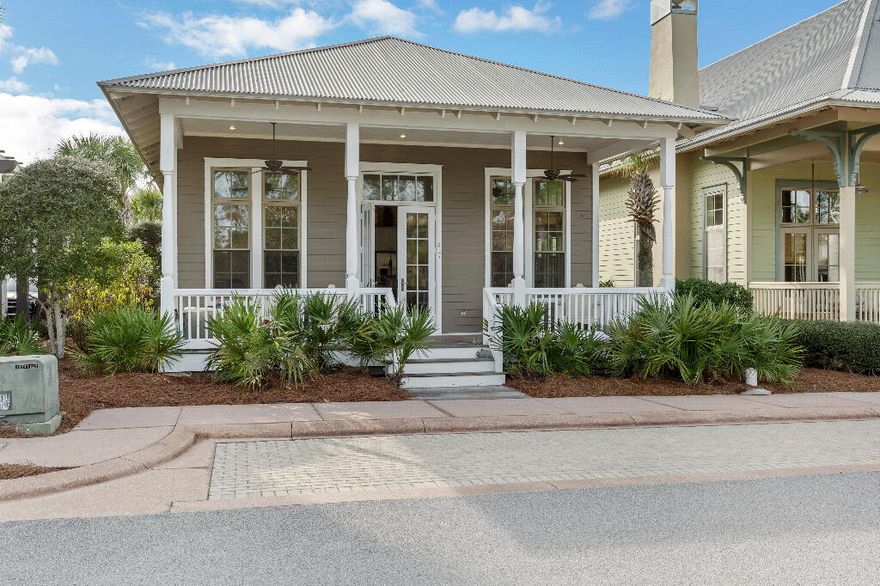 Beach cottage one level home.  Front and rear covered porches.  3 bedroom, 2.5 bath with vaulted ceilings. White cabinets with granite countertops and stainless steel appliances.  Hardwood floors.  Gated community with infinity pool overlooking dunes, hot tub, gym, tennis courts, clubhouse and another owner's pool. Hardwood floors just refinished October 2024. 2005 metal roof. HOA fees $1150/quarter.