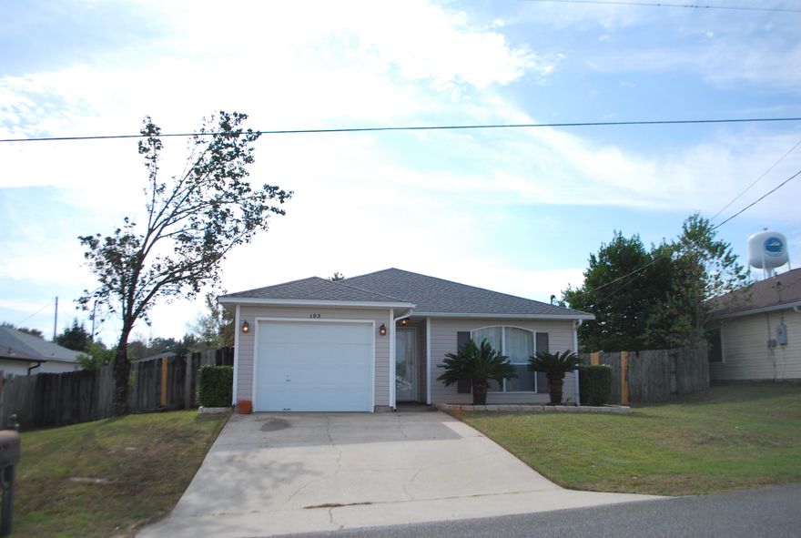 This South Crestview, FL home is waiting for a new owner to come in and make it their own. This open-concept home has 3 bedrooms and 2 bathrooms, a one-car garage, and a NEW ROOF! The master bath has double sinks and a walk-in closet with shelving. In the kitchen, you're sure to enjoy the island bar and pantry for a little extra cabinet and counter space. The open living room leads out to the backyard patio. It's just big enough for a fire pit, barbecue grill, and chairs to enjoy these cooler days and nights. Don't let this one get away. It's a blank slate waiting for you to make it home. Call today to view it!