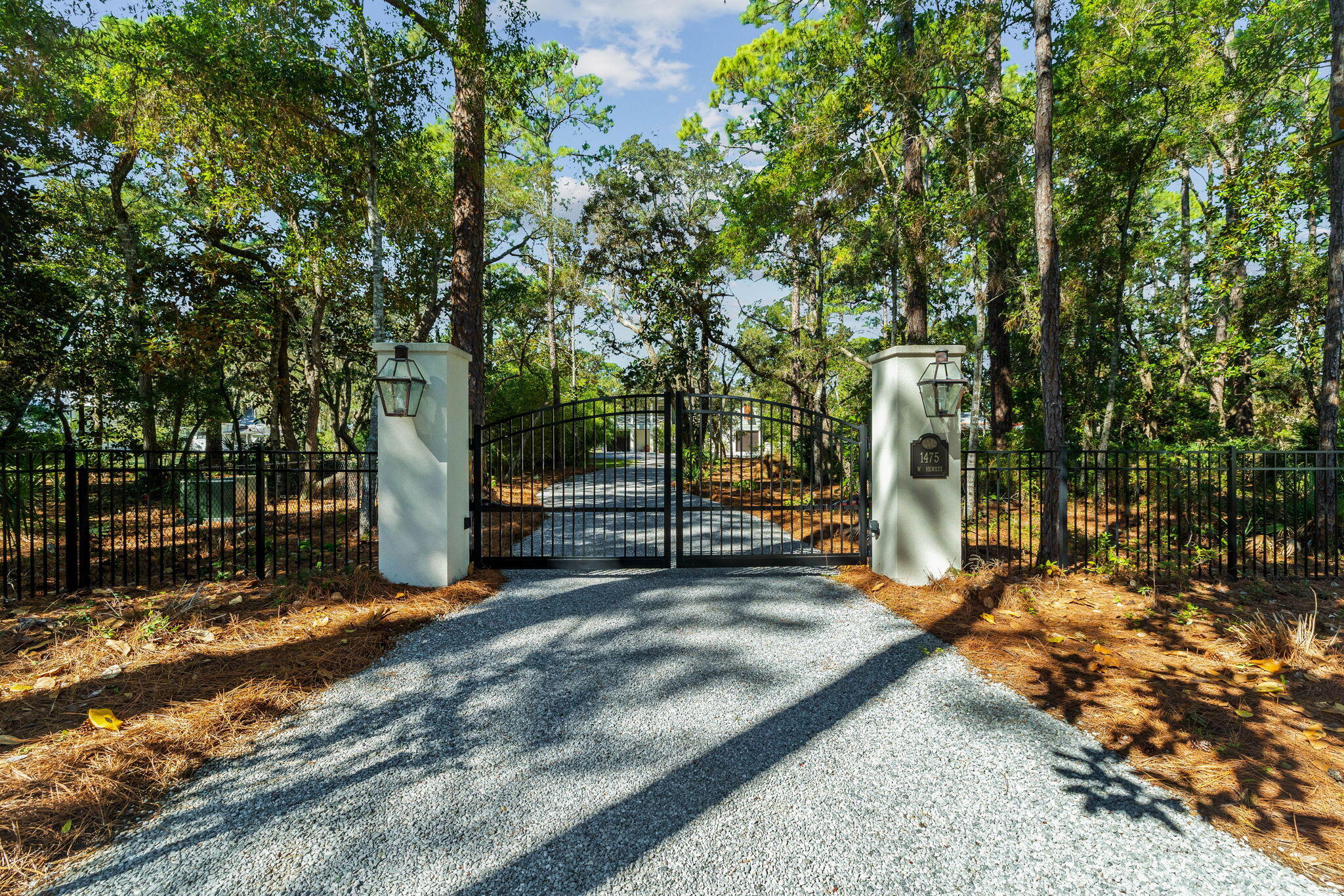 Tucked away behind private gates, this extraordinary waterfront estate redefines luxury coastal living on Hewett Bayou with .83 acres of prime bayfront land, 85 feet of year-round deep water frontage, and two impeccably designed docks--crafted for those who live life on the water. A winding drive meanders beneath a lush canopy of live oaks and towering pines, setting the stage for an estate that is both exquisite and private.Built in 2019 by the esteemed Burrell Elliott, this masterfully constructed residence is a testament to superior craftsmanship, offering an elevated fusion of architectural refinement and modern functionality. Every detail has been meticulously curated, from the finest high-end finishes to state-of-the-art appliances, ensuring both comfort and effortless sophistication.
For the dedicated boating enthusiast, this estate is unmatched in its offerings. This 85' x 407' lot provides unparalleled privacy and space, while the fully equipped dock - boasting a 12,000-lb. covered boat lift, fresh water, power, and flow-through platform, allows for seamless docking, world-class fishing, and endless days on the open water. A full composite-decking dock ensures both durability and timeless appeal.
As the sun melts into the horizon, the waterfront transforms into a serene masterpiece, casting breathtaking golden reflections across the bayou-best enjoyed from the private pool or the elevated outdoor living space, where a 75-inch TV, sound bar, and built-in gas grill create a flawless setting for luxurious al fresco entertaining.
Inside, the chef's kitchen is nothing short of spectacular, featuring a Wolf six-burner range with griddle, Sub-Zero refrigeration, an additional full-size freezer, and a Boos custom butcher block island. A gas fireplace adds warmth to the living area, complemented by tailored window treatments and remote-controlled Hunter Douglas shades, enhancing both privacy and ambiance.
The lower level, a solid concrete block structure with oversized pilings, offers 1,120 square feet of unfinished space, wired for AC and electrical - an exceptional opportunity for expanding living quarters, a guest retreat, or a bespoke workshop. This level also features a bathroom, cast iron Kohler double sink, built-in storage, and workbenches, while composite stairs lead to the upper terrace, seamlessly blending indoor and outdoor living.
Every inch of this estate is engineered for unparalleled convenience and security, with a whole-home generator powered by a 300-gallon owned propane tank, two tankless water heaters, a full water filtration system, Private Well, and Reme Halo UV light air purifiers in both AC handlers. The meticulous attention to detail extends to stainless steel hardware throughout, and every window and door is expertly cased for durability.
The option to create a magnificent family compound is available by combining with the adjacent lot for sale, effectively doubling the size to 1.66 acres.
Fine dining, luxury shopping and leading hospital and medical care are just minutes away. This is more than a home - it is a legacy estate, an exclusive retreat, and a once-in-a-lifetime opportunity to own a meticulously designed coastal sanctuary, where boating, fishing, and effortless luxury converge in perfect harmony.
