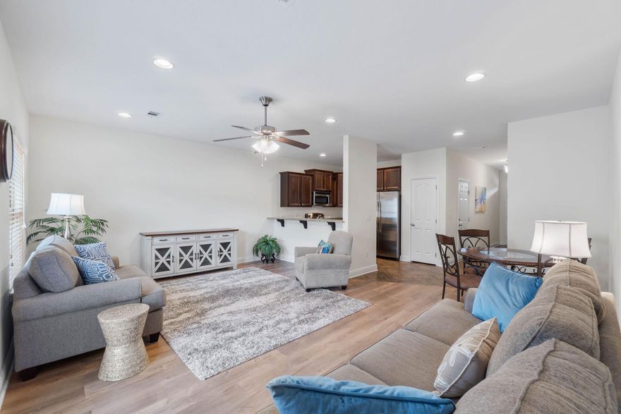 Simply Said....Welcome Home If you're looking for that move in ready home~look no further ...this wonderful Town Home offers an ideal location in a small community sub-division, Located in EAST NAVARRE Your 3 bed/ 2 1/2 bath home offers great family living space~just minutes from the beach~local stores and within easy driving distance to Hurlburt Field AFB. Community offers great curb appeal, with sidewalks~Community Pool & Playground~Landscaping & Palm Trees. This home is ideally situated in the center of the community with common green area to the back ,beautifully landscaped and fully enclosed back patio area. Entering the home you will be greeted by a entrance foyer with open flow to the great family room/dining area with gorgeous wood plank flooring making the living space cozy and bright. French door leads out to the back-garden courtyard which is fully fenced for privacy and enjoys a large patio ,extended pavers for your grill ,pine straw borders and gutters for low maintenance.
Wonderful kitchen with staggered cabinets~ hop up breakfast bar and S/S appliances. Downstairs also has a ?? bath with granite & under mount sink .Large Master bedroom offers a large walk-in closet and the master bathroom suite has a granite double vanity & step in shower. Additional bedrooms are a good size with double closets and additional bathroom with granite vanity ~ tub/shower. Laundry closet is upstairs for convenience. Home owner has installed~ LVP flooring in the main living room, blinds throughout~ceiling fans and a front Pella storm door.Home also offers Fiber Optic internet > HOA includes exterior building insurance and grounds maintenance. Call today to make an appointment to view this wonderful move in ready home.