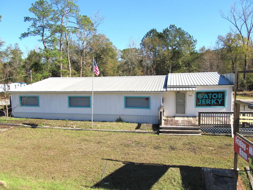 Looking for a great location to begin your next adventure.  This property offers great road frontage on Hwy 79 with ample space to handle most any type of service.  Front room offers small space with cafe style sink that once served as Ice Cream Shop.  Larger Spaces could easily be used for a multitude of options.  Tons of storage that could also be expanded for retail usage.  Parking area is large enough to accommodate large crowds.   Contents of building will be removed prior to closing so you can move in and begin sales at closing.