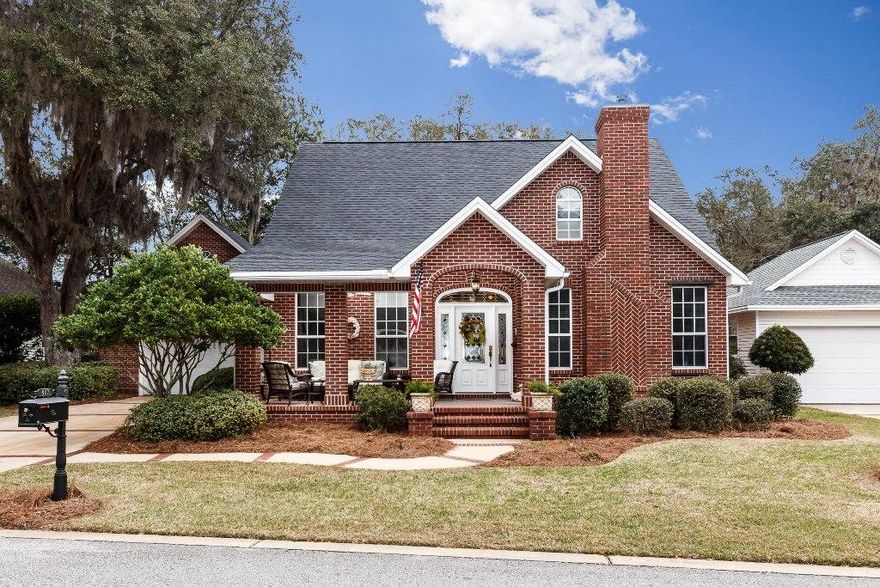 Carefree waterfront living in the charming community of Grand Oaks located on picturesque Boggy Bayou! This planned waterfront community nestled among gorgeous moss-laden oaks offers each homeowner a deeded waterfront parcel with a shared deep water dock! There is no need for flood insurance and you are only about 500' from your dock. This custom built, all brick home located on a low maintenance yard offers some water views from the front porch and living room. When you enter the home from the charming front porch you will find the bright living room featuring a gas fireplace, high ceilings and plenty of windows on the right. On the left is the formal dining room with wainscoting and crown molding that leads to the kitchen. The kitchen offers plenty of counter and cabinet space as well as a large pantry and a cozy breakfast nook. There are French doors in the breakfast nook that lead out to the large screened porch...the perfect place to enjoy your morning coffee! The downstairs master bedroom has a large walk in closet and roomy bath with a dual sink vanity, a whirlpool tub and separate shower. Up the back stairs, you will find a great bonus room...the perfect place for a home office! Up the front stairs are the two additional guest bedrooms that share the 2nd bath. These bedrooms have large closets AND storage in the dormers. This amazing home also features a 25KW full house generator, a 2009 Trane HVAC system, hardwood floors throughout the first floor, surround sound, central vacuum system, built in bookshelves and is MOVE IN READY. The dock that is only 500' away has electricity, water, a 1500lb lift and mooring poles for a boat slip (the perfect place for your sailboat!). Welcome home to a carefree waterfront lifestyle!