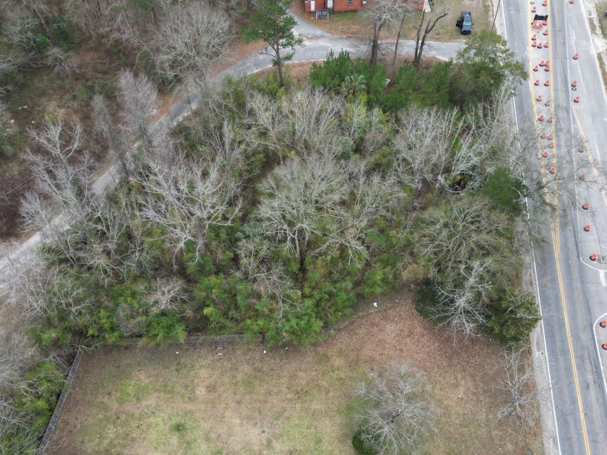 .3838 acre parcel per the city, Zoned Mixed use commercial / residential/ mix of 2. can have a triplex or mix of commercial and residential example: 2 story with residential on top commercial below. cant cover more than half the property w / your building. There is bamboo currently growing on property. See photos for elevation, flood zone, zoning PER the county GIS map