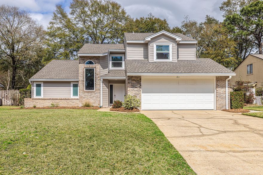 Fully updated 3 bedroom, 2.5 bath home located in the prime location of Niceville - Rockywood Estates.  Less than a 10 minute walk on the bike path to the grocery store, restaurants, a park, and a brewery!  Easily commutable to all the local attractions and a 20 minute drive to the world-class beaches of Destin.   Spacious living room with 18-foot ceilings and 2 skylights that bring in natural light, and a brick natural gas fireplace.  A newly renovated bonus room joins up with the living room, highlighted by a striking wood ceiling that could be used as a 4th bedroom for when guests visit or a home office.  The kitchen features granite countertops, shaker-style cabinetry with a soft-close feature, convenient slide-out shelves, and stainless steel appliances.  Main level primary bedroom