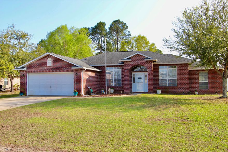 This home is fully bricked and has 4 bed 2 full baths. Check out your private in-ground pool with an enclosure! The livingroom is large and has a wood burning fireplace with blower. The eat in kitchen has a center island with all stainless steel appliances to include the refrigerator w/ ice maker.  The kitchen features ample maple cabinets and a nice size pantry. Split bedroom floor plan for your privacy. Enjoy the large fabulous Master bedroom featuring a trey ceiling. Master bath has cultured marble double vanity sink, separate shower, walk-in closet & sit back & relax in your jacuzzi tub. All bedrooms have ceiling fans & the faux wooden blinds through out the home will stay.