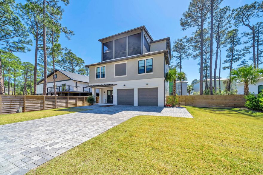 Built in 2022, this beautifully designed and elegantly furnished home in the coveted area of Oyster Lake on 30A. The modern floor plan includes multiple indoor and outdoor living spaces, an elevator which services all three levels, private in-ground swimming pool, outdoor kitchen, and much more.  The furnishings and decor were curated by Beau Interiors in Grayton Beach.  The moment you pull up to the property you will immediately notice the curb appeal, and features such as the oversized paver driveway, two car garage, screened in and covered 3rd floor patio, and the horizontal privacy fence surrounding the back yard of the property. As you head inside you are greeted by the foyer which leads you to the 2-car garage on the right, the stairs leading to the additional floors to the left, or straight ahead to the 1st floor sitting area, wet bar, bunk room with 6 built in bunks and ensuite bathroom, half bath, and laundry room with 2 stackable washers and dryers.

You can also head out to the back covered patio with outdoor summer kitchen, sitting area, and swimming pool with lounge pad. 
Take either the stairs or the elevator to the 2nd floor where you will find the sleeping space. Here you will find the master bedroom and 3 additional bedrooms all with private bathrooms. The master suite has access to the 2nd floor covered balcony, large walk-in closet, double vanity, floor to ceiling tiled shower and soaking tub. 
On the 3rd floor is the main living space and two more covered balconies. Here you have the sitting area, dining table for 10, and kitchen with quartz counter tops and kitchen island/breakfast bar. All stainless-steel appliances adorn the kitchen, and the oversized, walk-in pantry is something of dreams. There's even another storage closet inside the pantry where the 3rd floor HVAC can be found. Outside on the back facing patio you have yet another sitting area and ceiling fans which can also be found on the front facing balcony which additionally is screened. 
Being adjacent to 30A means beach access, dining and entertainment are all just a walk or golf cart ride away. Don't wait, schedule your private showing TODAY!