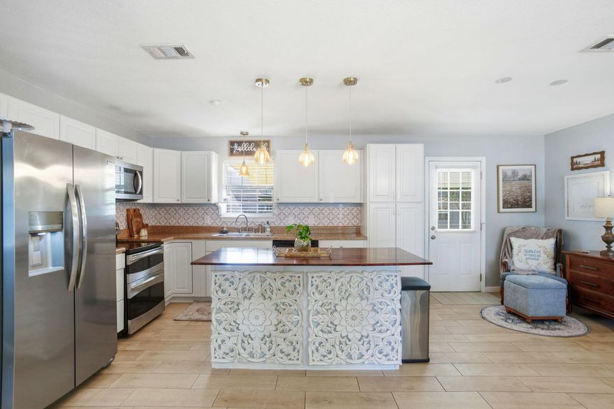 Welcome to Bonanza--where charm, flexibility, and Emerald Coast lifestyle come together.You will absolutely fall in love with this adorable and well-maintained three-bedroom home, perfectly positioned near the water without being in a flood zone.From the moment you arrive, the pride of ownership is undeniable. The property is fully fenced with a deep driveway and beautifully maintained landscaping, complete with mature plants, shrubs, and thoughtful stepping-stone details that immediately make you feel at home. Inside, you'll find an updated kitchen with all appliances conveying, opening into a cozy and inviting living space. A convenient bump-out area provides the perfect spot for a home office, just around the corner from the stackable laundry area (washer and dryer are negotiable). The former garage has been professionally converted into additional living space, creating a welcoming breakfast or formal dining area as you enter the home.

Recent updates include fresh paint, updated doors, and flooring throughout. Step outside to discover a large powered workshopideal for a true workshop, hobby space, or easily convertible into a mother-in-law suite. The extended patio offers plenty of shade, making it perfect for relaxing summer evenings.

The lot provides additional footprint for future expansion, allowing for more bedrooms or bathrooms if desired. With no HOA, there's ample room for RV parking and recreational toysyes, bring the boat! Enjoy casual strolls down the road for water views, easy boat launching, and a laid-back coastal lifestyle ideal for pets, kids, and outdoor enthusiasts.

All of thisnear the water, outside the flood zone, no HOA, and incredible flexibilityat an attractive Emerald Coast price point in the low $300s. The sellers are also offering a flexible closing timeline.

Join us for our upcoming double open house weekend, or schedule a private showing with advance notice. This Bonanza beauty truly checks every box.