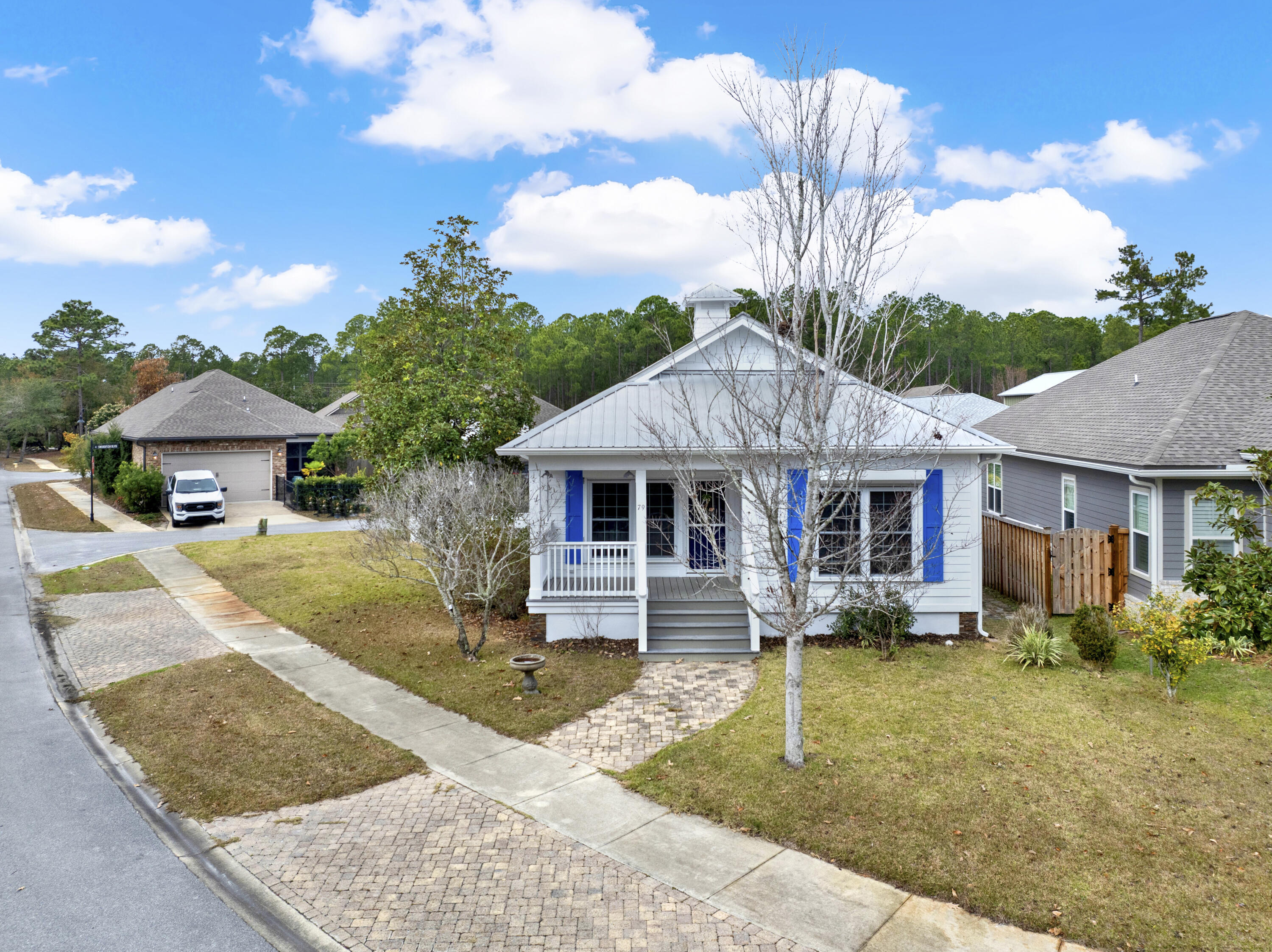 This charming corner-lot cottage in the Marina Village community offers an open floor plan, hardwood floors, Brand new Paint, Hurricane Shutters and a screened-in porch. Modern touches include a tankless water heater, a 2023 HVAC system & with a Metal roof. A neighborhood full of amenities like a pool, playground, dog park, and a nearby marina for fishing and outdoor fun. A perfect blend of comfort and convenience! Ready for move in!