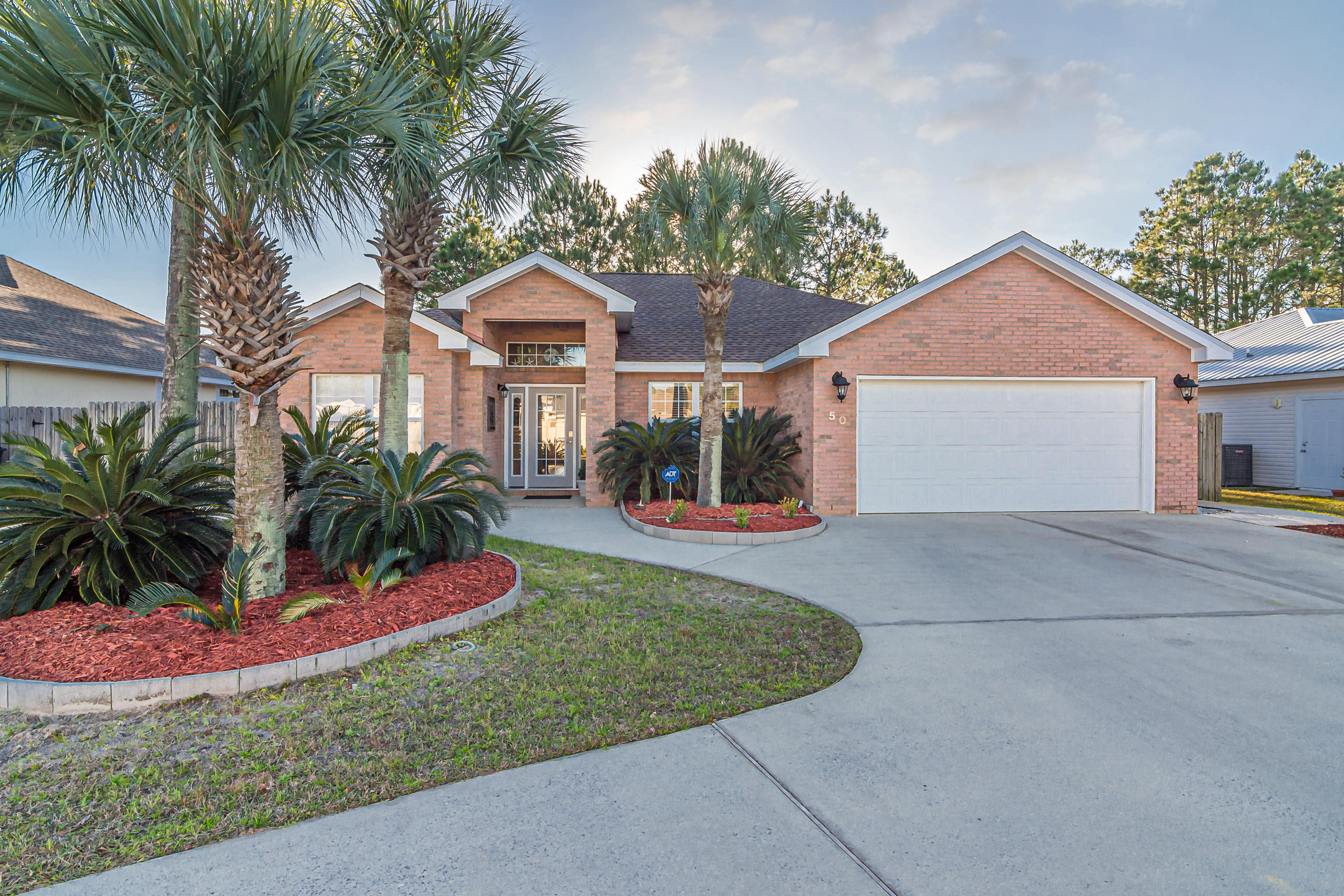 Buyers Financing fell through! Back on the Market! Will not last! Great Location and Price! Walk to the Beach!! 3 bedroom, 2 baths with a Huge, Fenced Backyard! Remodeled Kitchen in 2018 with Granite Counters, Upgraded Cabinet Doors and Hardware, Kitchen includes a Breakfast Bar and Views the Family Room, New Roof in 2019 with lifetime warranty and transferable within the first 10 years, New French Doors going to the Large Backyard in 2019, Large Master Suite and Master Bath with Tub and Walk-In Shower, Spacious Secondary Bedrooms, Office with Built-In Cabinetry, plus Circular Drive and Parking Pad! Look at how close the Gulf is in the Aerial photos! Amazing!