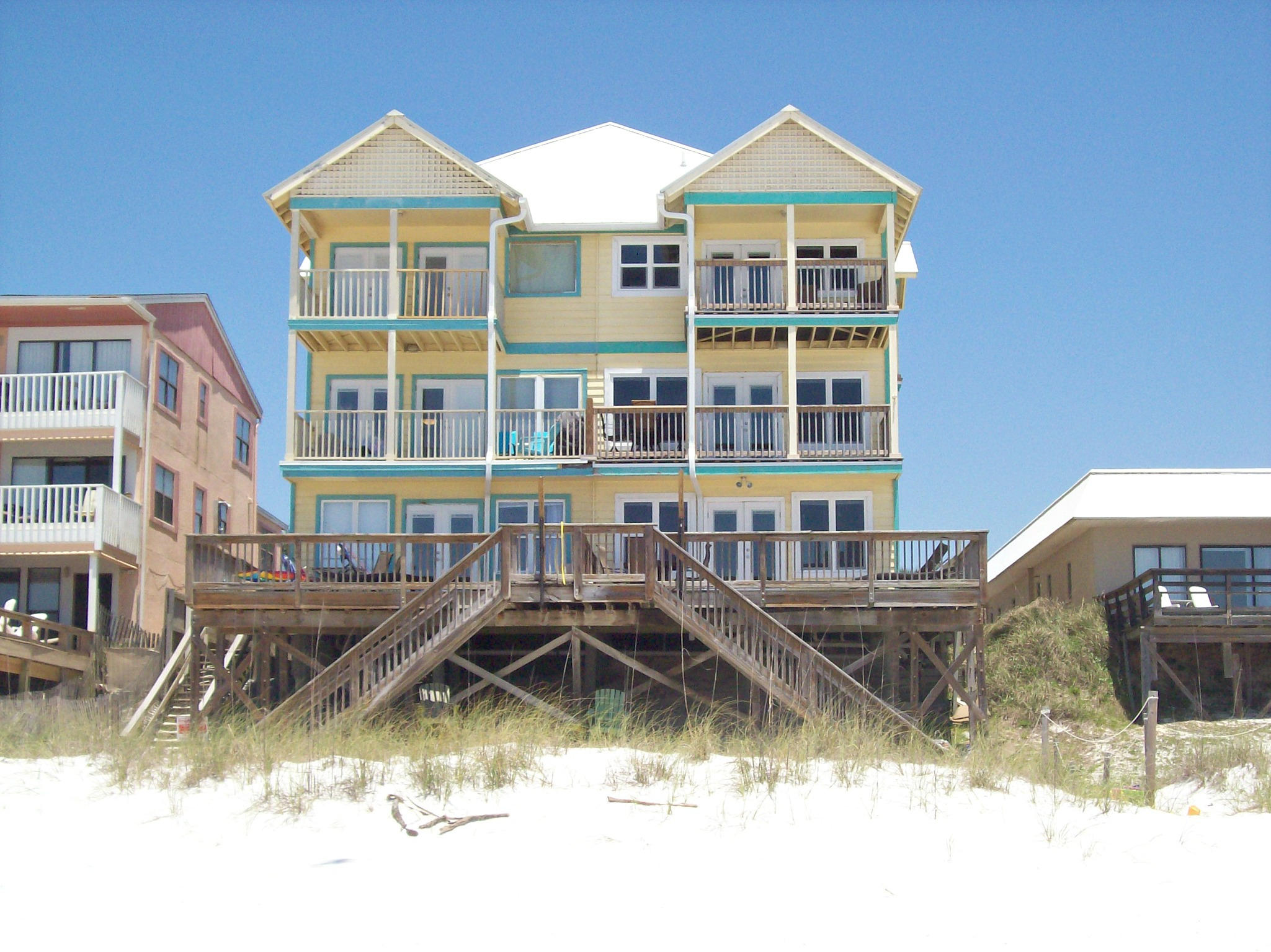 EXCELLENT OPPORTUNITY TO OWN THIS DIRECT GULFFRONT TOWNHOUSE WITH MILES AND MILES OF UNOBSTRUCTED VIEWS OF THE SUGAR WHITE BEACHES AND EMERALD GREEN WATER OF THE GULF OF MEXICO! Wonderful second home or get-away for your family and friends and a great investment property. Just walk down the steps from your private deck right onto the beach and from there you can enjoy sunbathing, reading, swimming, fishing and romantic walks along the shoreline. Step through the leaded glass front door into the foyer with custom tile flooring. Gulf front bedroom with a private bath, oversize whirlpool tub and kitchenette with refrigerator, microwave and a sitting area. Additional bedroom on this floor with bath. Upstairs is the spacious living room with windows surrounding your incredible views.