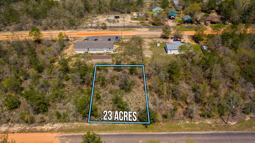 Great quarter acre lot on a paved portion of the road. Ideal for a new build or a mobile home! Level lot and close to town.