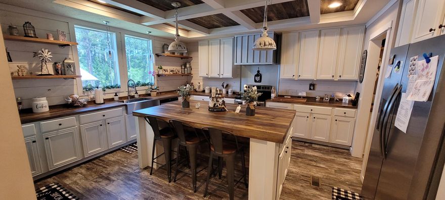 Well taken care of home on 4.59 acres south of I-10 in DeFuniak Springs. Improvements on property include the main home with 3/2 and 1812 sq feet heated and cooled. The main home has been kept very clean and free of issues. There is a pole barn for the parking area. Incredible covered deck in the back of the home and overlooks the property and the pool. The is a second home on property that is a 1 bedroom and is approximately 800 sq feet. There are 2  septic systems and 2 power poles. Also on the property is what the current owner calls his man cave. It has covered parking with a gathering area. It also has full shower with bathroom. Located 1.5 miles from Highway 331 and 3 miles from I-10. Great access to I-10. 30 minutes to beach. Located in the center of DeFuniak's growth area.