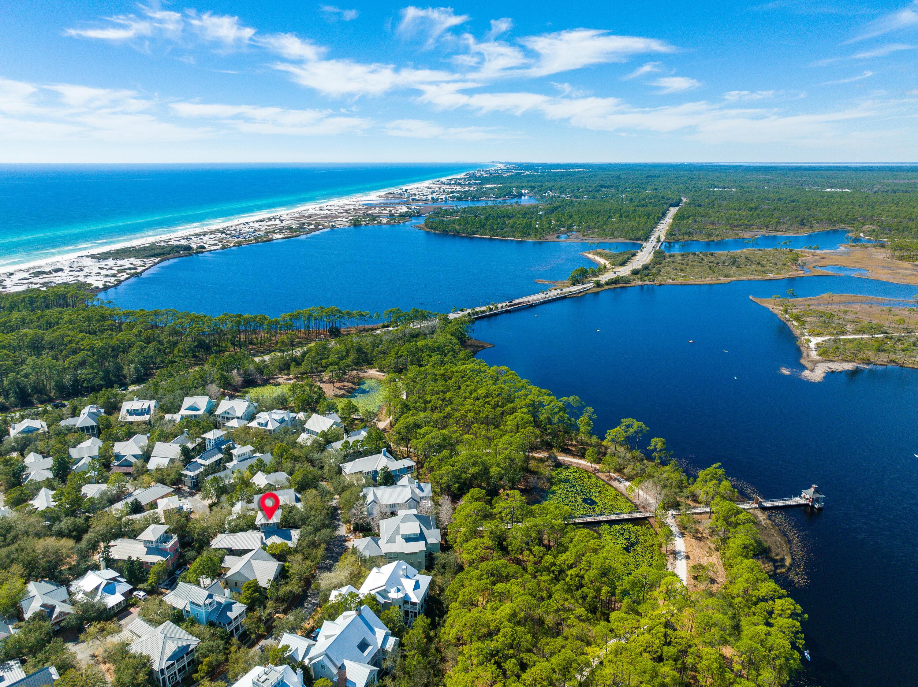 This distinctive Florida Beach house designed by Tom Christ is located in WaterColor's Premier Park District and affords many upgraded custom features. The first level delivers two spacious guest suites which include their very own private baths & walk in closets. One of the suites offers a discreet sleeping porch. The first level also provides a laundry/mudroom, private screened logia complete with cabana bath and a two-car garage. The spacious second level offers an open concept kitchen, dining and living area, a cozy fireplace and grand piano vestibule ideal for entertaining friends and family. Cherry floors and vaulted ceilings with heavy beams add to the ambiance of this home.