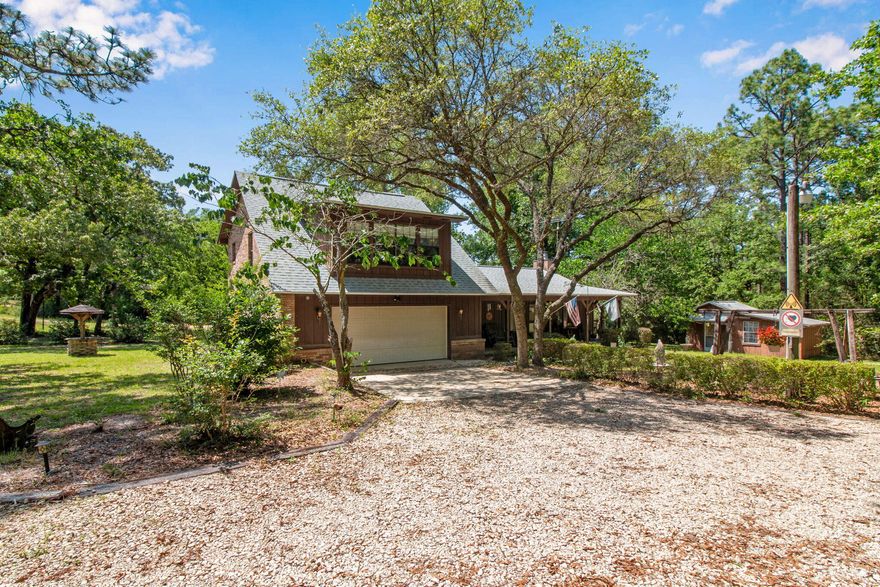 Welcome to 2509 S. Lakeview Dr. A versatile 2-story, spacious and charming 3-bedroom, 2-bathroom home set on 4.5 lots, livestock-friendly, private and full of potential home in North Crestview. With 2,098 sq ft, a two-car garage, and room to roam, this property offers rare versatility -- whether you're dreaming of a mini-homestead, an income-producing investment, or a peaceful retreat.Inside, you'll find a warm and welcoming layout featuring vaulted ceilings, a stunning brick fireplace, and hardwood floors that flow through much of the main level. The large upstairs primary suite offers a peaceful escape, with the 2nd bedroom upstairs as well and the 3rd bedroom and 2nd full bathroom downstairs, offering comfort and convenience for family or guests.

The kitchen is full of vintage charm and functionality, with plenty of cabinet space and sightlines into the living and dining areas  ideal for hosting or everyday living. Additional highlights include:
    "    New well pump (2024)
    "    Dual showerheads
    "    Ceiling fans throughout
    "    A mix of tile, carpet, and wood flooring

Outside, the property backs up to county-owned land for added privacy and tranquility. And here's where the potential really shines:
    "    The two unencumbered lots offer buildable space for another home, shop, or guest house  or can be sold off individually for profit.
    "    With ample yard space and no HOA, there's room for chickens, goats, or even a few sheep, making it perfect for those seeking a light agricultural or homestead lifestyle.
    "     Enjoy this property's 10' x 20" insulated with heat and air storage shed. 

Whether you're looking to invest, expand, or put down roots with a few animals, this unique North Crestview property is loaded with opportunity.

Schedule your private showing today and discover all the ways this home can work for you!