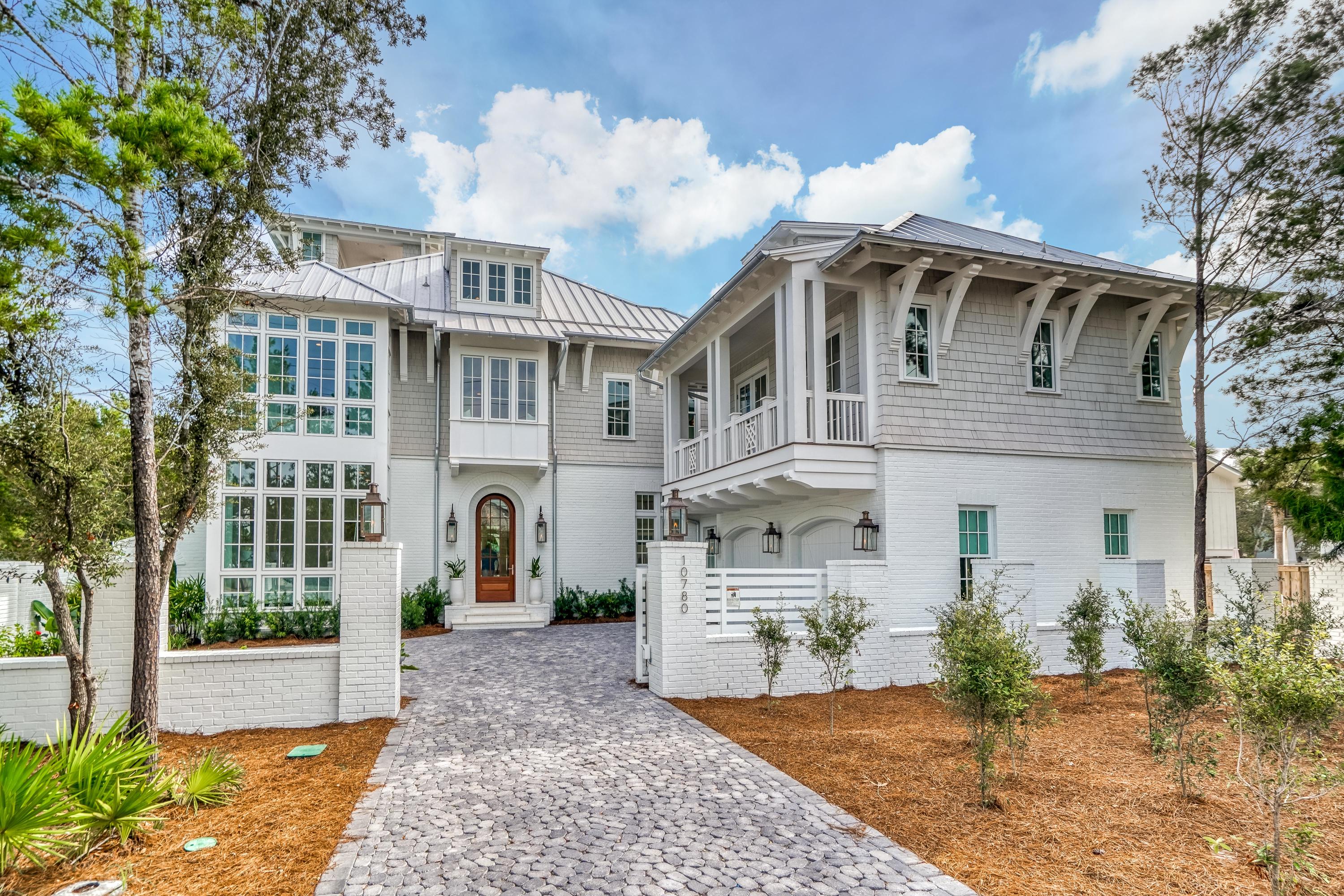 Nestled in a premier location adjacent to Rosemary Beach, this incredible new construction estate offers over 5,600 square feet. The main residence includes five bedrooms each with ensuite plus a one bedroom carriage home with ensuite over the two-car garage. A stately privacy fence & remote gate surrounds the property which includes a luxurious outdoor entertaining space with private swimming pool & screened porch with fireplace & summer kitchen. Designed by T.S. Adams Studio Architects, the accommodating floor plan features open concept living and dining, a multitude of natural light, dual master suites, showcase curved staircase & open-air tower showcasing the panoramic views of the Gulf of Mexico. Exquisite finishes throughout include venetian plaster, shiplap walls & ceilings,