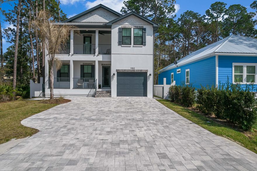 Brand New HOT TUB on patio! Completed in 2021, this like new contemporary custom home is a vacation rental with impressive rental history of $118,522.66 from Jan 2023 till Aug 2023. This 4 BR 4 1/2 BA comes furnished and turn key/rental ready. The light, bright chef's kitchen has a waterfall quartz island which is large enough to serve as a breakfast bar, an oversized sink, pantry, and stainless steel appliances. The living area with its distinctive brick wall is spacious enough to bring everyone together and decide whether it will be a Gulf or Bay day, since the house is situated on Co Hwy 393 between the Gulf and the Bay. With the primary bedroom and bath, with a large soaking tub, on the first floor and the other bedrooms with ensuite baths on the second floor, everyone is able to have their own private space. Custom touches including custom lighting, quartz counters, and luxury vinyl planking throughout.The outside of the house is well designed, just like the inside, with a covered deck and an oversized fenced in the backyard that is mostly paver stones for entertaining. After a day on the bay there is a space for parking your boat behind the back fence of the house. Whether you want a primary, secondary, or a vacation rental this home has NO HOA and can be the perfect beach dream home you have been looking for.