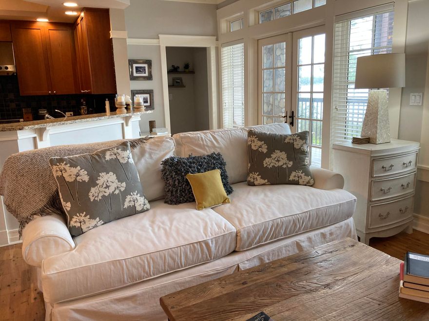 Water Views and Sunsets with a totally private balcony to enjoy them on! This beautifully decorated corner unit is move in ready! Just hang your clothes in the closet and head to the beach or put your kayak or paddle board in Lake Powell and begin to enjoy life here. Dock is right outside your door. Wild Heron has many amenities to enjoy - 2 swimming pools, fitness center, outdoor fire pit, barbecue, picnic area, and 24 hr.guarded and gated Security. Only minutes from the gulf and the 30A communities of Rosemary and Alys Beach, the unit is ready for immediate rental.  To view, call Joan Luchese at 850-585-7595.