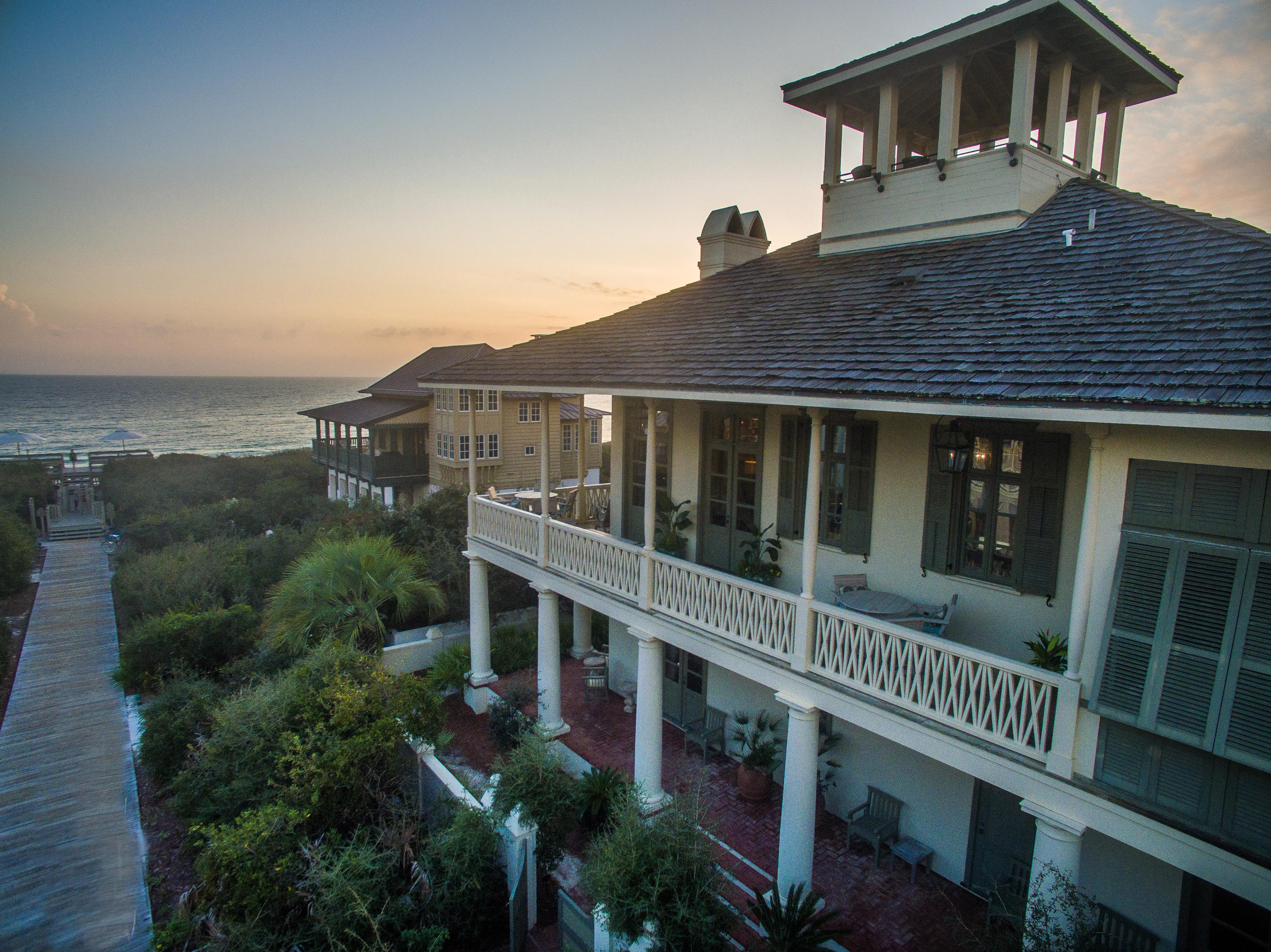 This magnificent home brings together the elegance of a Southern plantation and the delightful pleasures of a gulf-view beach cottage. Located just one off from the Gulf, the Main House is 3925 Sq. Ft. and the Carriage is 484 Sq. Ft. (All measurements are approximate and should be verified by and interested buyer). The main house's 2015 gross was $264K and $60K for the Carriage house. Fantastically located with views that are absolutely stunning make this home an absolute must see. Check out the 3D Virtual Tour of this home in the photo section.