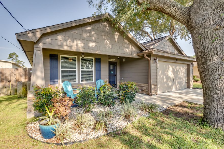 Location, Location, Location!!! Almost New Craftsman Home in the heart of Navarre! Move in Ready! Stunning home with 3 bedrooms and 2 bathrooms, Spacious Open Floor Plan, Granite counters with a huge breakfast bar. Stainless appliances and a huge pantry. Beautiful Woodgrain look tile flooring throughout the entire home! Master bedroom has a trey ceiling and spacious closet. Double vanities and garden tub/shower. The other 2 bedrooms share the hall bathroom. Enjoy the privacy fenced backyard from the covered patio. There is also a covered front porch. The front yard has the most beautiful mature trees which are so unusual for an almost new home. 2 car garage. This house is on sewer. Walking/biking distance from the Navarre Park and bridge to Navarre Beach, shopping and restaurants.
