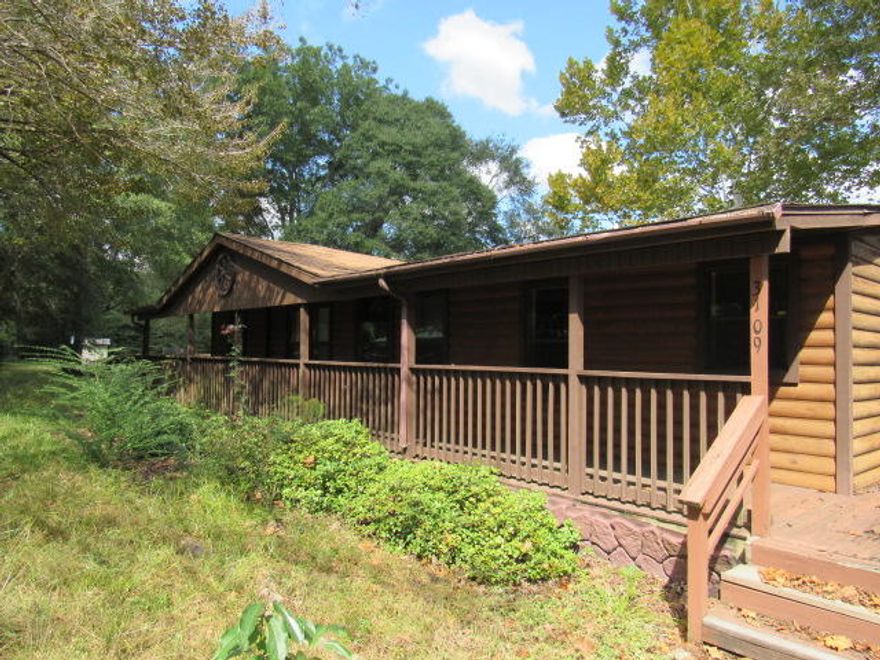 REO opportunity centrally located in Crestview. This 3 bedroom, 2 bath mobile home sits on 1 Acre and feels private and has a log cabin look! The porch wraps around most of the house. This is a split bedroom house with a large living room. There is a also a dining area next to the kitchen. The kitchen is very large as well with a lot of cabinets and counters. There is also a breakfast area on the other side of the kitchen that has the sliding glass door to the back yard. There is a laundry room that has a side door leading the porch. Bedroom two and three share the hall bathroom on the other side of the house. There is also a shed in the yard. Property being sold 'as is'. Buyer to verify all pertinent information as to satisfy themselves.
