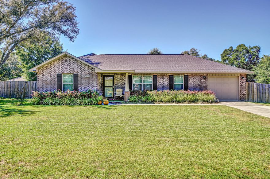 This move in ready Navarre home is perfect. The outside has brick and vinyl siding with vinyl eaves and soffits and a LARGE back yard. The main living area has a cathedral ceiling and vinyl flooring. The home has an open floor plan with a combo dining and kitchen area that has custom cabinetry and granite look tops. The master bedroom has a large master closet and across the house are the two guest rooms with the guest bath. Both the front and the back of the home have covered porches.  Come check out this adorable home!