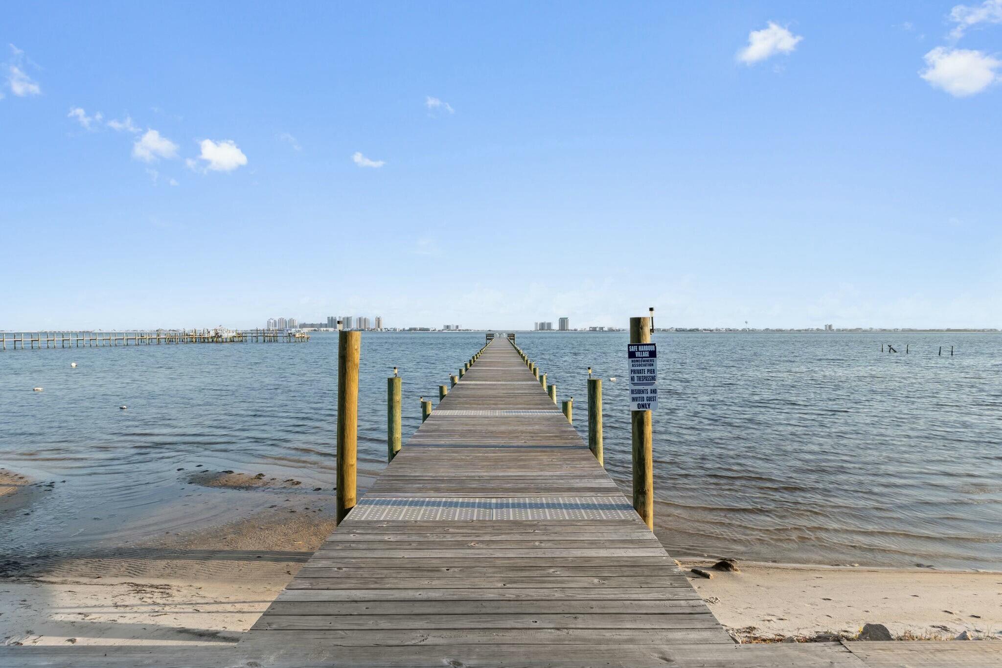 ** Seller to pay 1 year of HOA fees with a full price offer. Welcome to the private, gated community of Safe Harbour Condo Village in Navarre, FL.  This beautifully updated 2 bedroom waterfront condo overlooking Santa Rosa Sound is available and ready for you to move right into or rent out. So many updates: new flooring, freshly painted, crown-molding added, recessed lighting added, updated kitchen, updated fixtures, updated bathrooms, and patio floor has been epoxy-finished.  There are so many beautiful finishes to this condo, you will not want to miss out on the opportunity. Conveniently located across the street from the Publix Shopping center, restaurants and shops.  It's just minutes from the Navarre Beach Bridge. There's a community pool and dock to fish on and enjoy the sunsets. Call today to schedule a private tour!