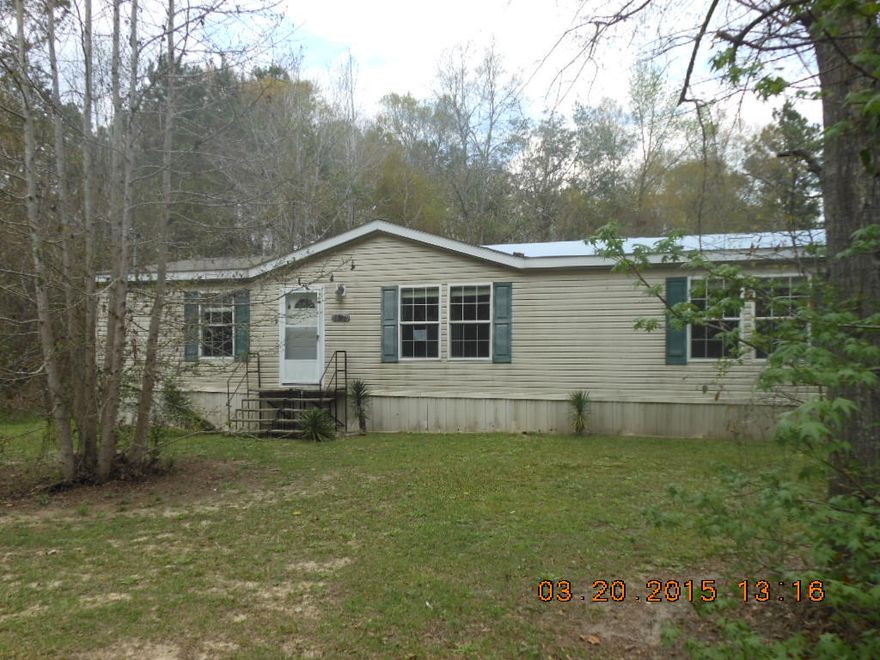 2006 double wide mobile home on lot in city limits of Vernon, FL. City water and sewer. Home needs roof replaced as there are leaks in master bedroom and bath. Property is being sold as is. There is a small stream on property that appears to be a wet weather stream.Paved road frontage. Near old Vernon high school. Possibility to obtain a renovation loan to get repairs done. Home appears to be structurally sound and major repair is the roof. Carpeted throughout except vinyl in baths and kitchen. Central heat/air and total electric. Location is convenient commute to Panama City.