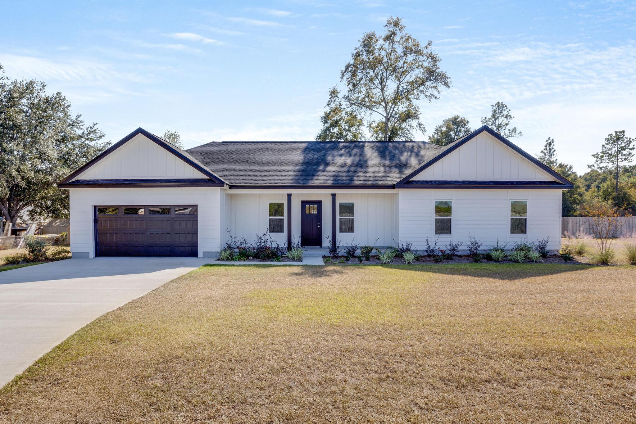 Welcome to your brand new home crafted with local quality by skilled craftsmen! Timeless aesthetic with white cabinets complemented by carrara deluxe quartz countertops in kitchen. Both bathrooms offer shower/tub combos, while the master bathroom has a double sink and a generously sized walk-in closet, providing ample storage space. Additionally, the oversized garage adds to convenience while the modern fixtures throughout the home, adding to its contemporary charm. Outside, the exterior showcases durable Hardi board and batten siding, along with Hardi lap siding, ensuring low maintenance and long-lasting appeal. The black dimensional shingles add a modern touch to the roofline. Lot offers the perfect spot for a camper/motor home and/or workshop.