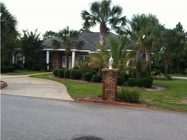 Located in the prestigious and convenient gated golf community of Emerald Bay, this three bedroom, two and a half bathroom home is a perfect permanent residence or vacation home. Just minutes from the beach as well as the dining and shopping options of both Destin and South Walton, this meticulously kept home offers an abundance of indoor and outdoor living space, beautiful landscaping, and plenty of upgrades throughout the home. This sunny one story home is welcoming and inviting. The cozy den would be a perfect office, playroom, or nursery. The separate dining room offers additional space for more formal entertaining, while the spacious great room, complete with a fireplace, opens onto the covered lanai and pool. The lanai is spacious enough for a large grill and plenty of lounge