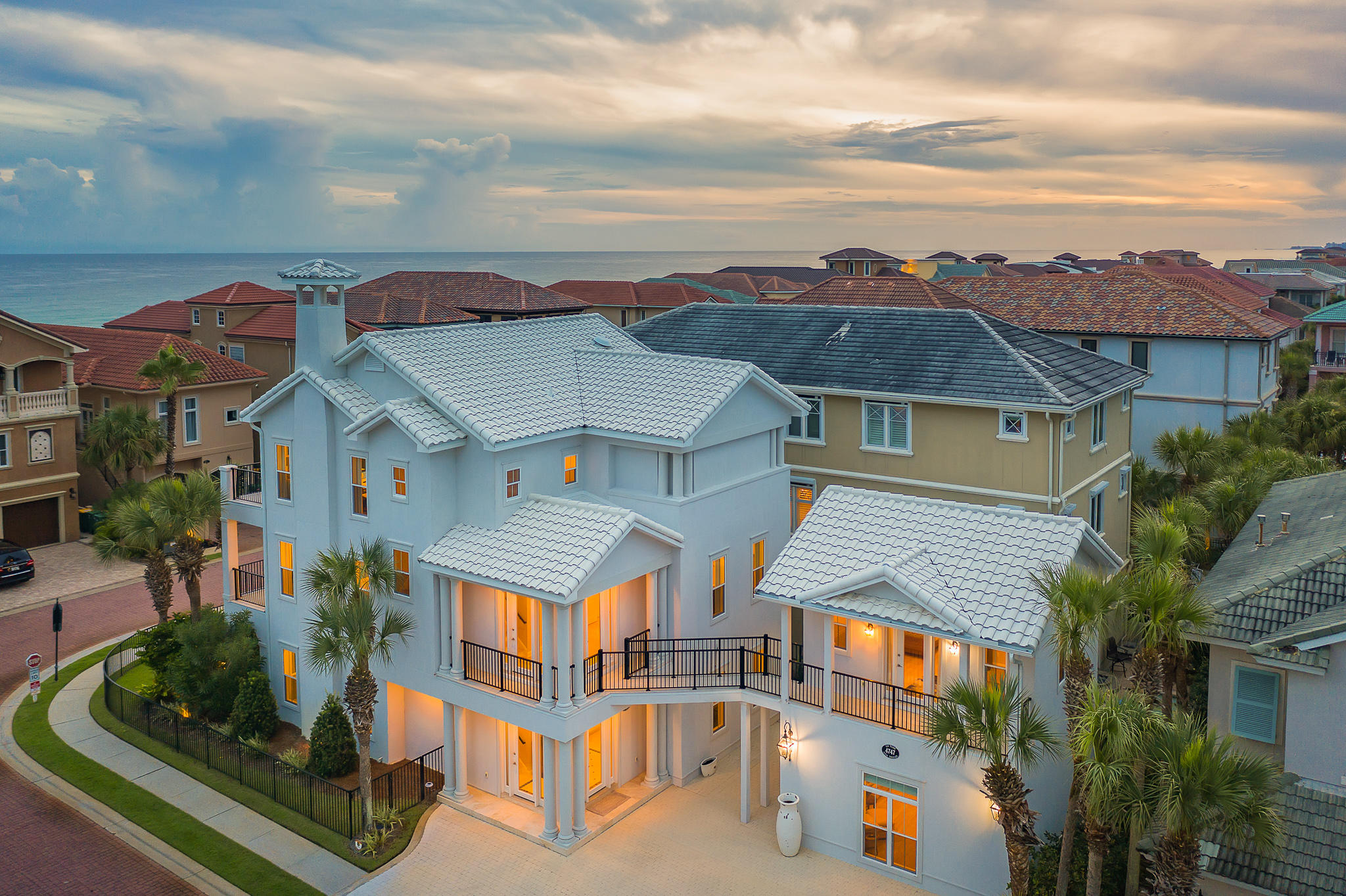 Incredible opportunity to own in prestigious gulf-front community, Destiny by the Sea. Stunning beach home located just one tier off the gulf and renovated from top-to bottom. Over 1M spent in renovations, up to current code!! Update include: Stucco, roof, AC units, flooring, all new balconies, updated tile on all balconies, all bathrooms, Kitchen...nothing overlooked! The home evokes the feel and charm of coastal living with timeless architecture, finishes, and designer decor. This impressive 5 bedroom/6 bathroom estate is ideally located on an oversized corner lot, between two private deeded beach access points as well as just steps from the community pool & spa.