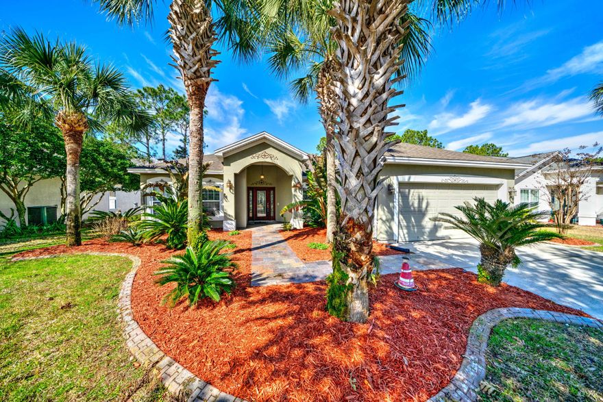 105 Kensington Circle Panama City Beach Florida 32413.This beautiful home is in walking distance to Whole Food Market, restaurants and Frank Brown Park. The back yard sanctuary with screened in salt water pool is bug free and ready for your family. The split floor plan has a spacious kitchen with stainless steel appliances, black granite counter tops, custom cabinets that include lighting and breakfast bar.  Easy maintenance ceramic tile throughout living areas. Elegant entertaining with matching dry bar, 10' ceilings and gas fireplace. Bedrooms enhanced with luxurious cherry wood flooring.  Storm shutters included for added protection. Lot dimensions approx. taken from property appraiser site.