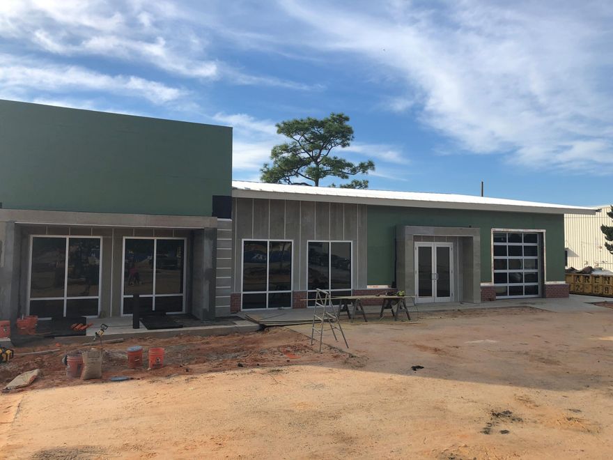 Brand new building with high ceilings and large storefronts great for office or retail. Roll up door on the north side and decorative roll up glass door on the front. High ceilings with stained concrete floor. Possible tenant improvement allowance for 5 year lease. Led lighting and single bathroom for 2000 tenant and two bathrooms for 4,000 space.