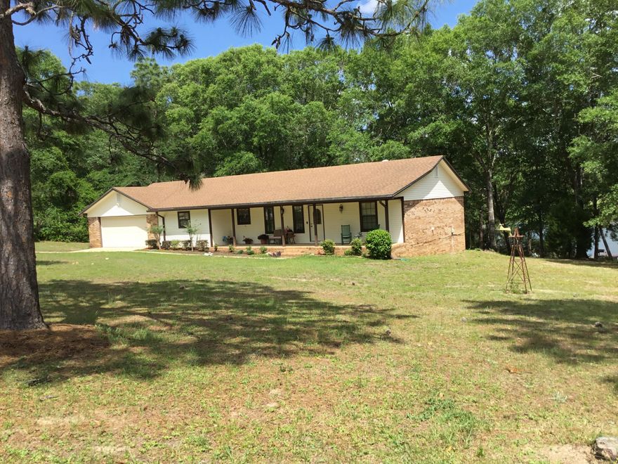 This inviting home sits on 3.79 acres and boast a beautiful lake front view from the back deck. With three bedrooms and two full baths with vinyl flooring in bath areas and kitchen and carpet in main living area and bedrooms. Complete with a whole home generator, and a separate room in the garage area that could easily be used as an extra office space or room of your choice. There are also two sheds on the property and a dock. Seller is providing a home warranty. **Buyer to verify all information deemed important.