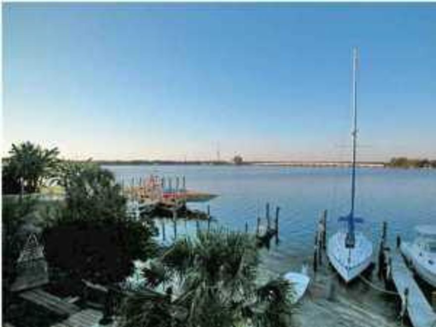 Waterfront town home with sunset views in a great location in Shalimar! Amazing water views from three levels. Living room, dining area, kitchen, and powder room all on second level. Living room with cozy corner fireplace opens onto a great deck, perfect for grilling, watching the dolphins play, and gorgeous sunsets. Stairs from deck lead down to the first level onto a patio, just steps to a deep water boat slip that will accommodate a large boat or sail boat! First floor entry foyer opens to stairs that go to second level living area. First floor has a one car garage and a large bonus room with a full bath. Third level master bedroom overlooking the bay ~ great panoramic views! Another bedroom and bath complete the third level. This unit is a rare find, very seldom does a unit come