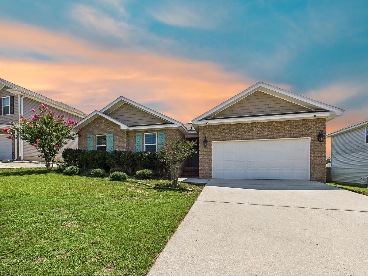 This 3 bed, 2 bath home features an open-concept layout with a split bedroom floor plan for added privacy. The spacious primary suite includes a huge walk-in closet, perfect for all your storage needs. Enjoy the convenience of a 2-car garage and step outside to a beautiful paver patio, ideal for relaxing or entertaining friends and family. The fenced-in backyard offers a great space for pets, play, or gardening. Located in a friendly neighborhood with easy access to schools, shopping, and bases, this home is move-in ready and full of charm. Don't miss your chance to make it your own!