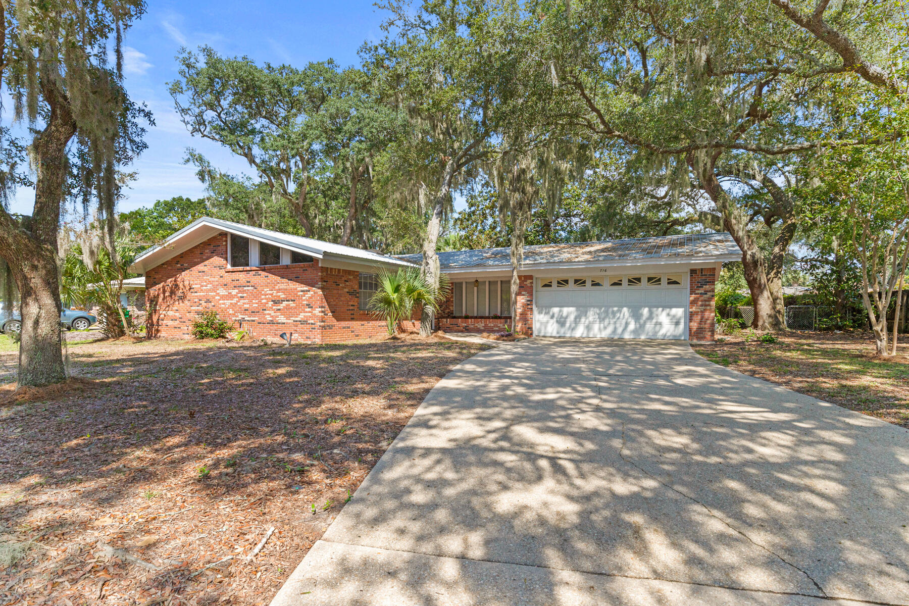 Imagine stepping into a home where comfort and endless possibilities await. Nestled in the heart of the cherished Overbrook neighborhood in Fort Walton Beach, this delightful gem warmly invites you in. The freshly painted interior accentuates the bright, airy living space showcasing vaulted ceilings and a charming brick accent wall.The expansive backyard is your blank canvas, waiting for your imagination to bring it to life--whether you dream of blossoming gardens, playful afternoons, or tranquil evenings beneath the shade of mature trees. It's a peaceful retreat that promises to become your sanctuary. Enjoy being located just minutes from the emerald coast beaches and less than 2 miles from the Fort Walton Beach Boat Launch along the picturesque Santa Rosa Sound, this home offers a true coastal lifestyle. A short distance away is Liza Jackson Park, offering the perfect place for weekend picnics or playful adventures. And close by is John M. Beasley Park, which welcomes you with sandy shores and space to enjoy sports or beachside relaxation.
716 Overbrook Street is more than just a house, it's a canvas waiting for your personal touch, a place where memories will blossom, and life will unfold. With its unbeatable location and welcoming atmosphere. Make this home a reality. Schedule your private tour today and start your next chapter here!