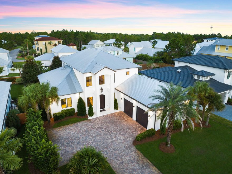 Sophisticated design combined with superior construction greet you upon entry of this west 30A home. Situated in the gated community of Cypress Breeze, the features of this custom-built home are truly endless. The property seamlessly integrates professional design with luxury amenities and stylish selections. Premium materials paired with a well-thought-through floor-plan create a timeless design to be enjoyed for generations to come. As you enter through the grand foyer, soaring ceilings draw attention to a beautiful staircase. Flowing directly from the great room, the living space is created for gathering and entertaining. The space is highlighted by the stunning gas fireplace. From the living, an elegant dining room showcases a taste of the gorgeous lighting found in the home.