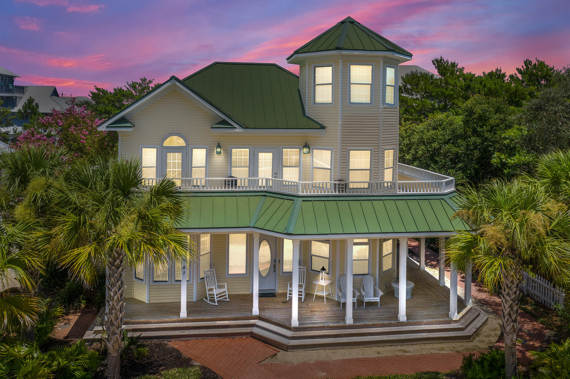 Situated on a large lot in close proximity to a beach access, this 5 bedroom, 4 full bath, and 1 half bath Victorian beach home is the perfect investment or second home. This home offers plenty of room to relax with 2,758 sq ft. Inside the home on the 1stfloor, you will find a spacious open concept living and dining room with a fireplace and wet bar. Beautiful hardwood floors flow throughout the first level. Off the dining room there is a window lined sunroom with shiplap that floods the space with an abundance of natural light. The master suite is located on the first floor with an attached en-suite master oasis, with a walk-in closet, his and her vanities, soaking tub, and a walk-in shower. A laundry room can also be found on the first level.The 2ndfloor has 3 guest bedrooms and 1 full